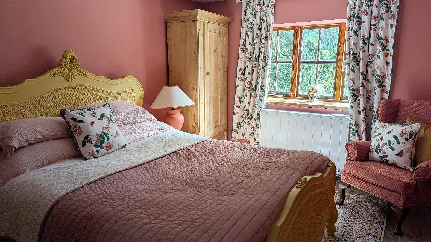 Floral Accent Pillows Complement Peach Walls and Bedding