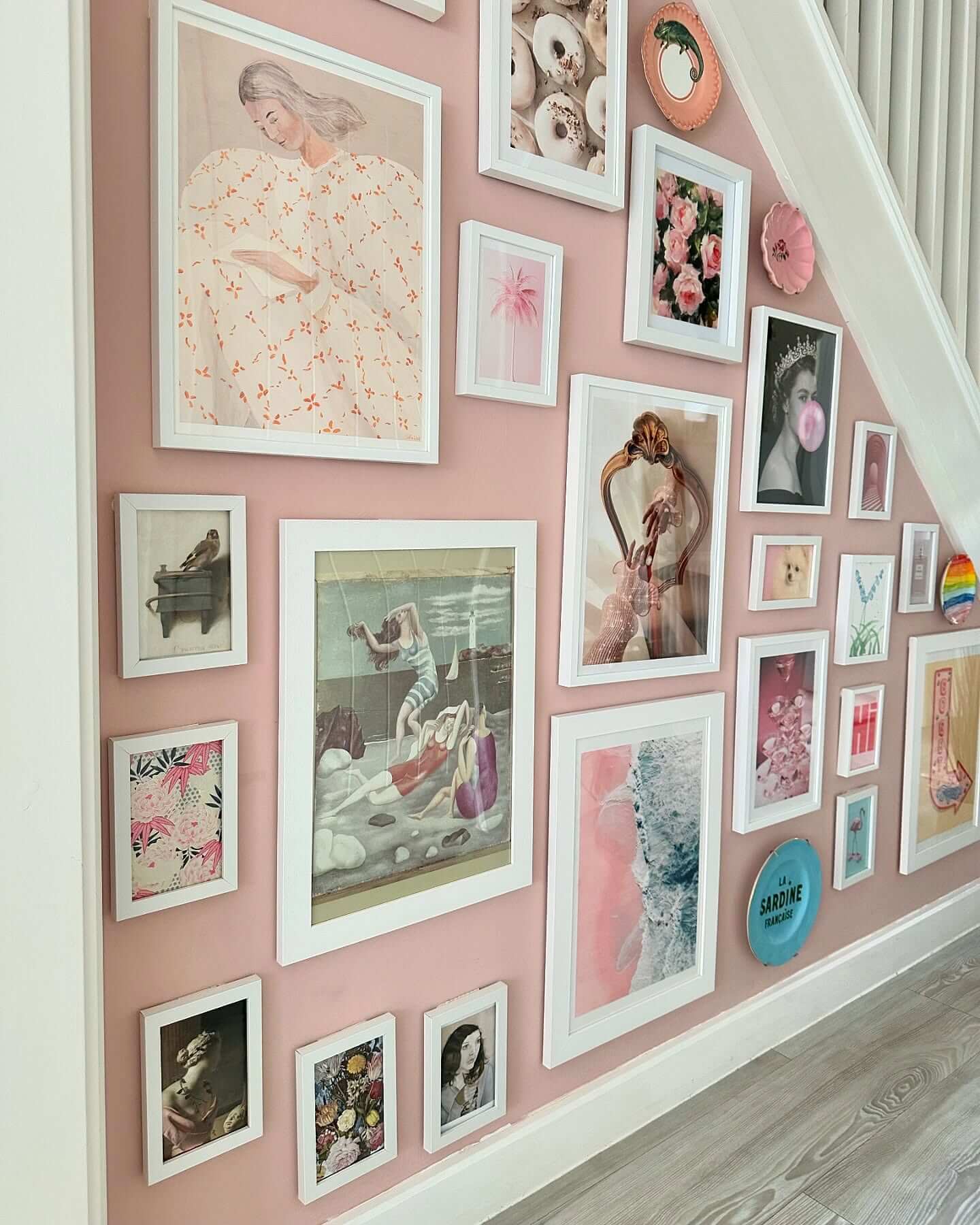 Gallery Wall Mixes Vintage Scenes with Modern Portraits