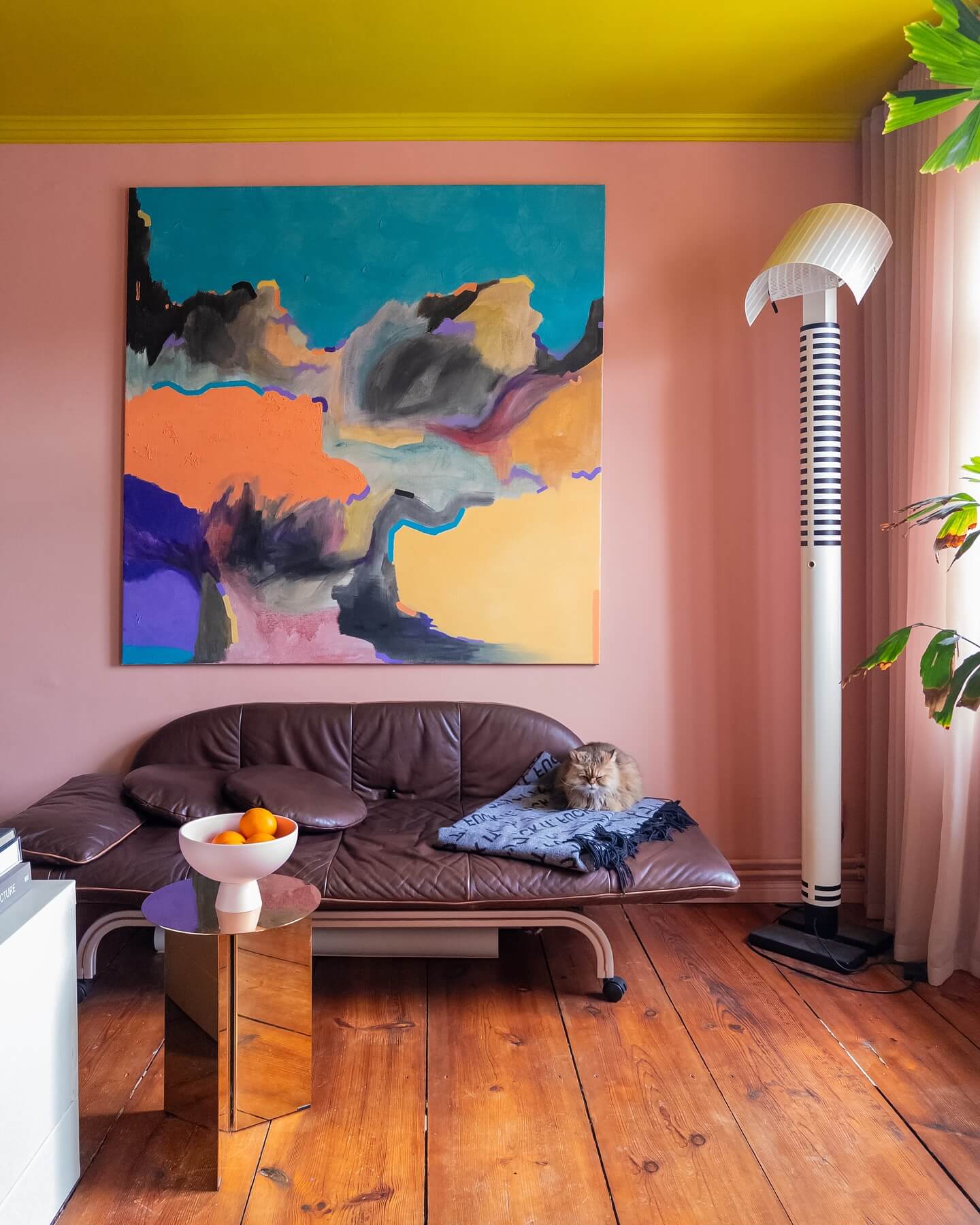 Oversized Abstract Art Anchors a Pink and Yellow Room