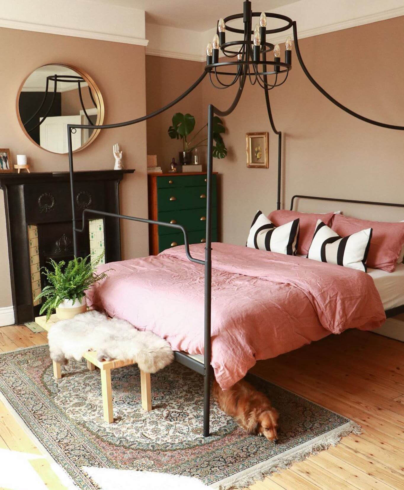 Pink Canopy Bed Frame With Black Chandelier