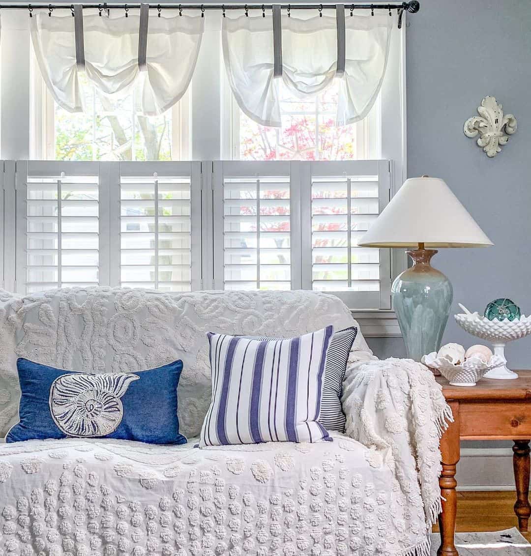 Nautilus Shell Pillow Adds a Nautical Motif to White Sofa
