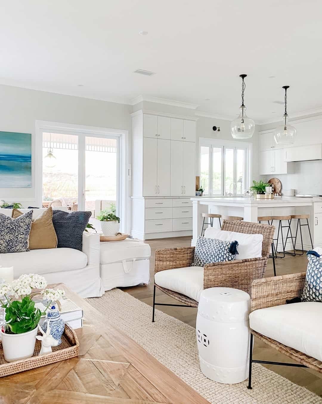 Place a White Ceramic Stool Between Woven Chairs
