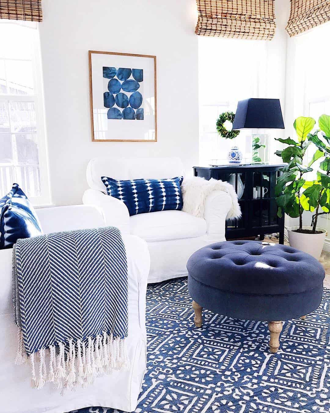 Deep Blue Tufted Ottoman Grounds the Space