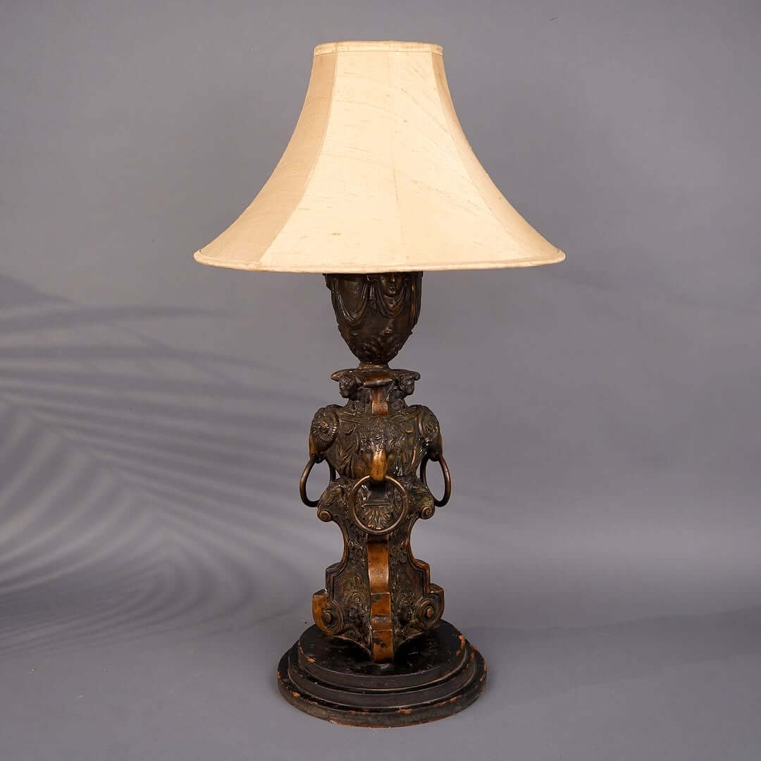 Ornate Bronze Lamp with Ram's Head Details Adds Character