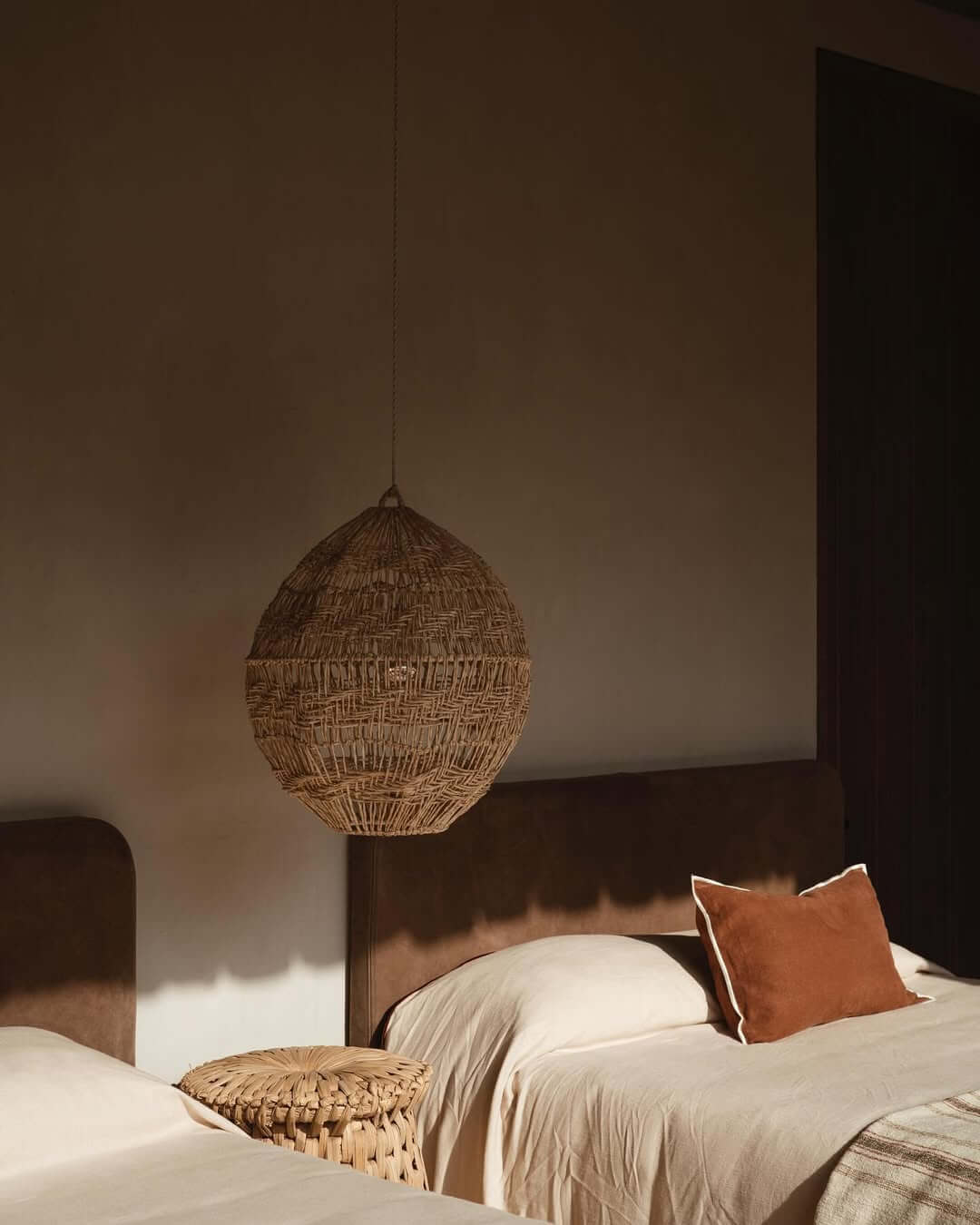 Woven Pendant Light Adds Natural Texture Above Beds