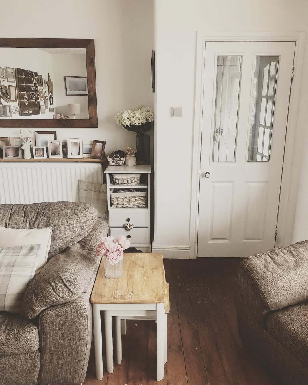 Mirror Hung High Creates a Gallery Wall Above Radiator