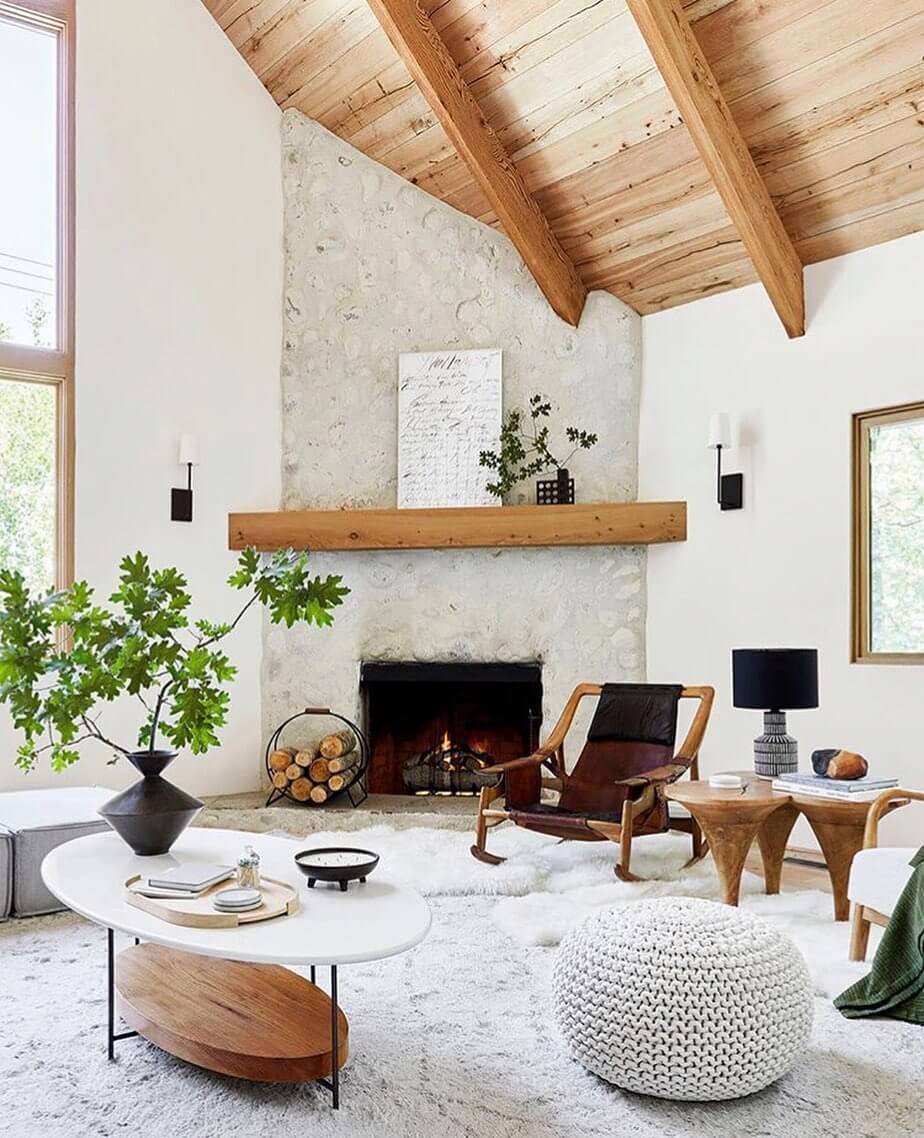 Feature a Rustic Stone Fireplace with a Natural Wood Mantel