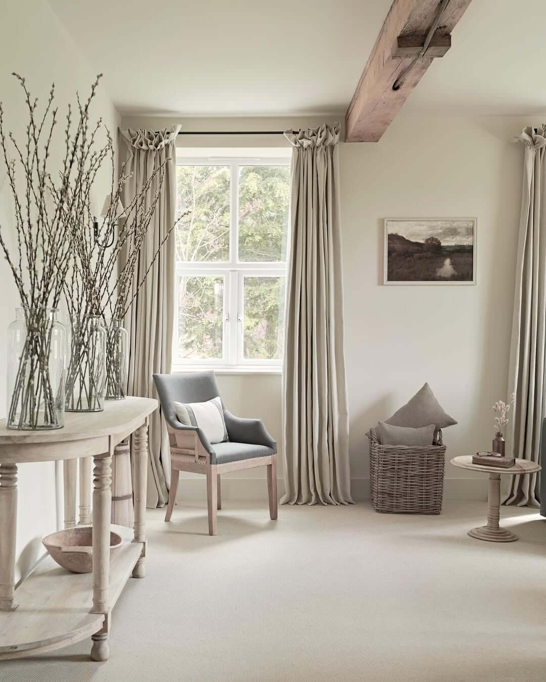 Tall Glass Vases Hold Natural Branches for Airy Decor