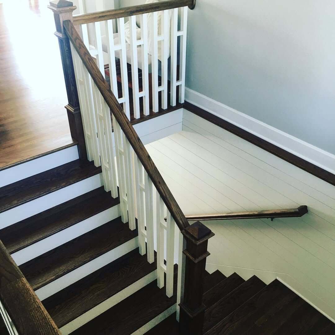 Contrast Dark Wood Stairs with White Shiplap Walls