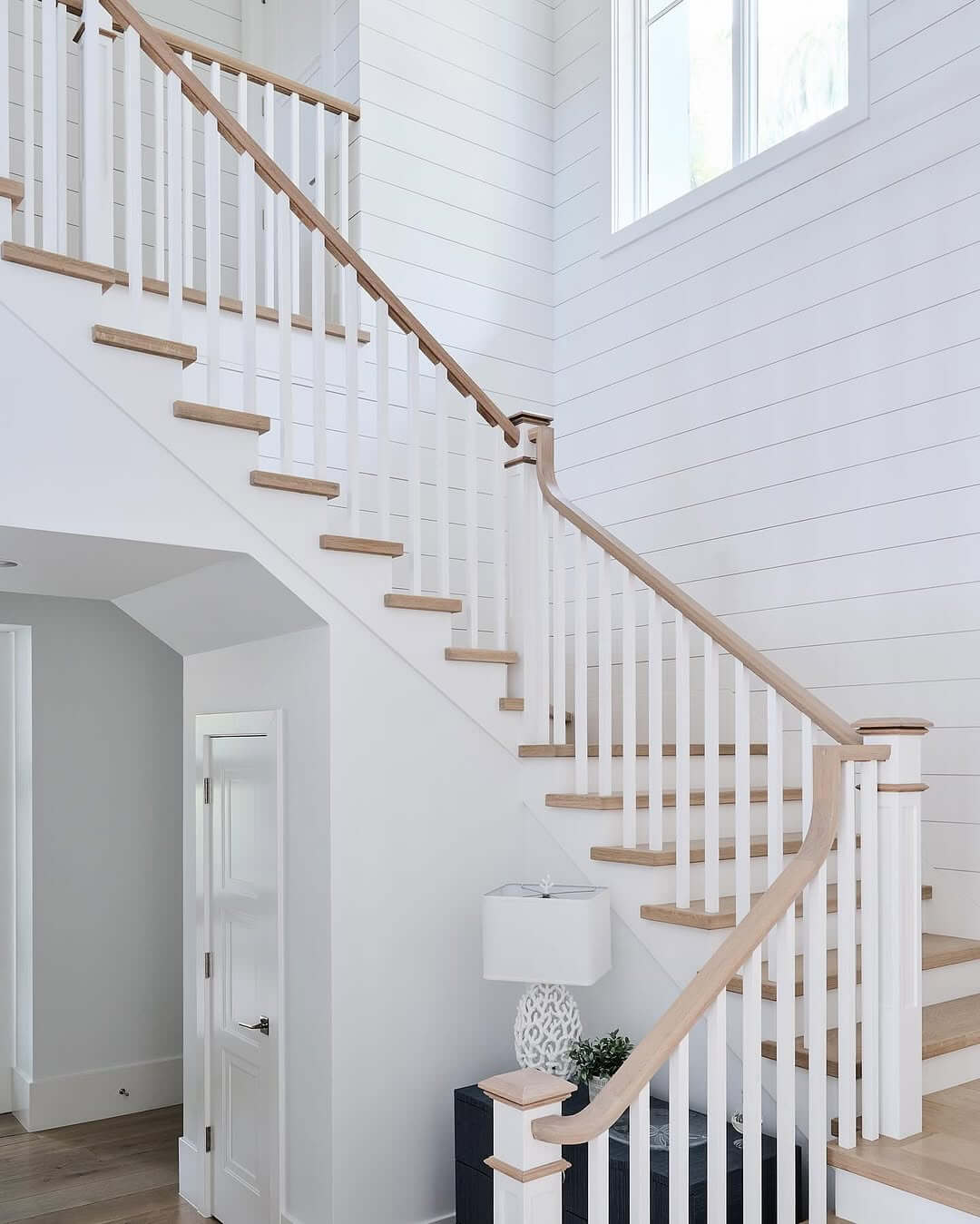 White Shiplap Walls Create a Bright Staircase Backdrop
