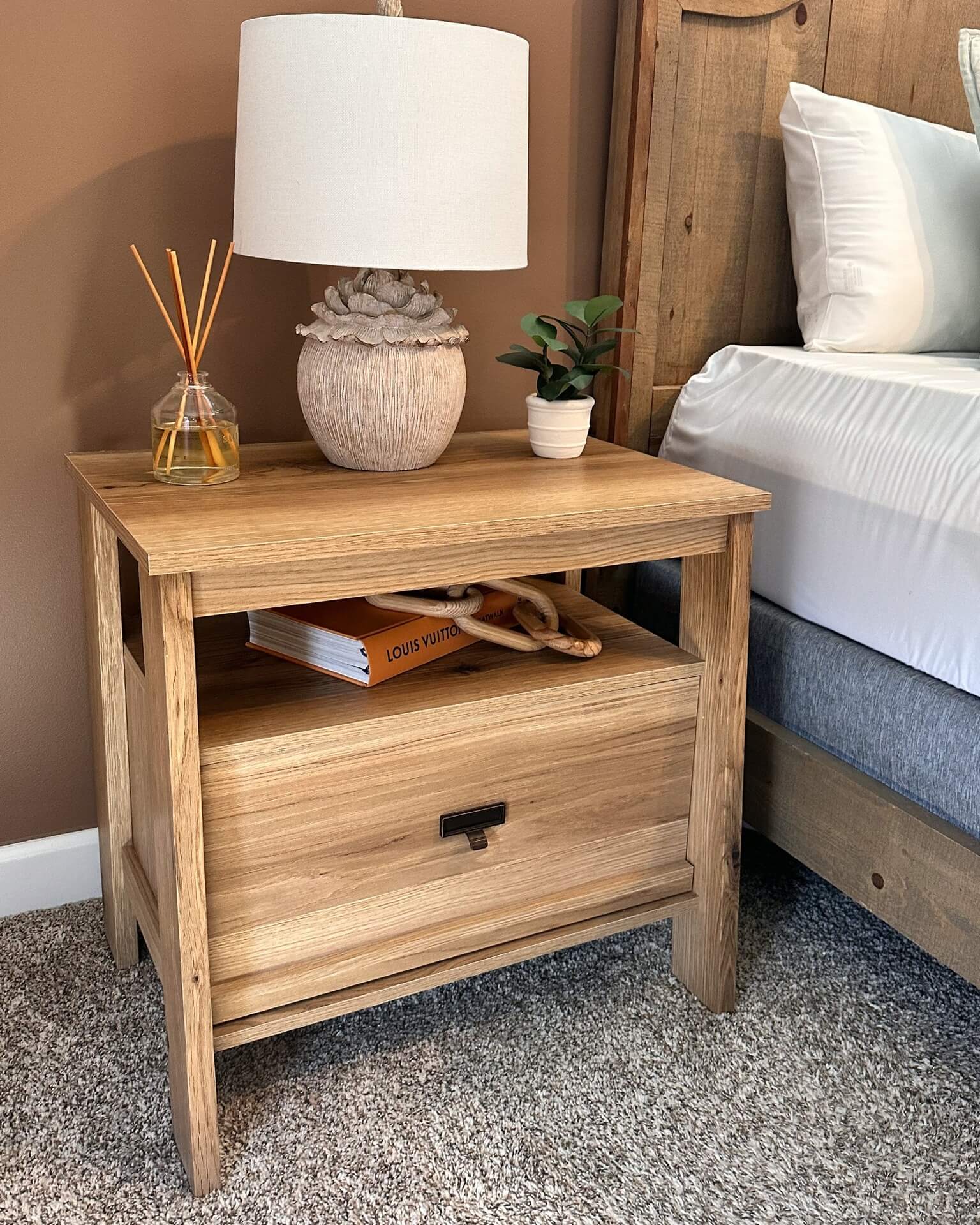 Textured Lamp Base Adds Organic Shape to Natural Wood Nightstand