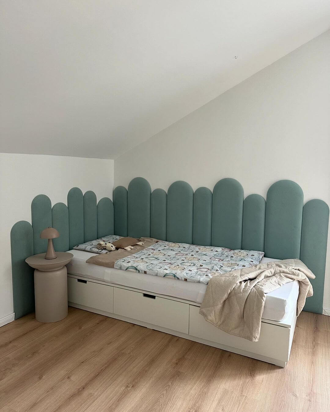 Scalloped Teal Headboard Adds Playful Texture Behind the Bed