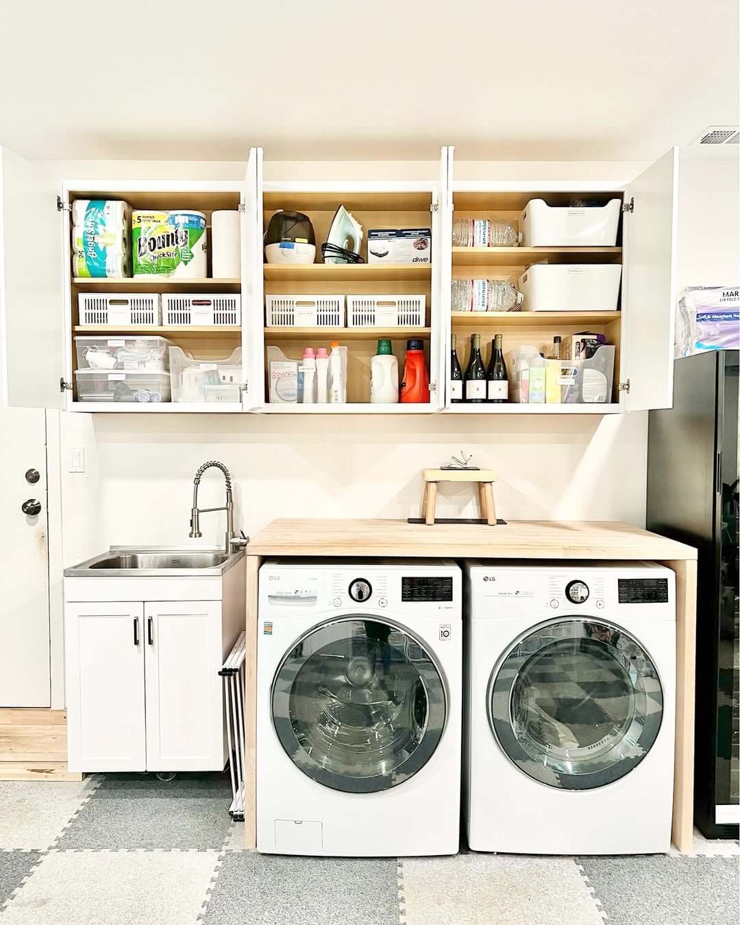 White Baskets Organize Small Laundry Room Items