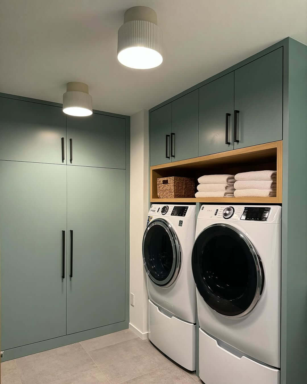 Open Wood Niche Holds Folded Towels and a Basket
