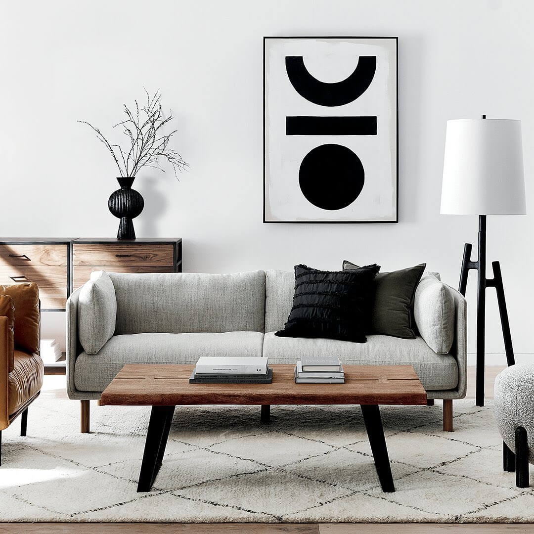 Abstract Artwork Adds Bold Geometric Focal Point Above Sofa