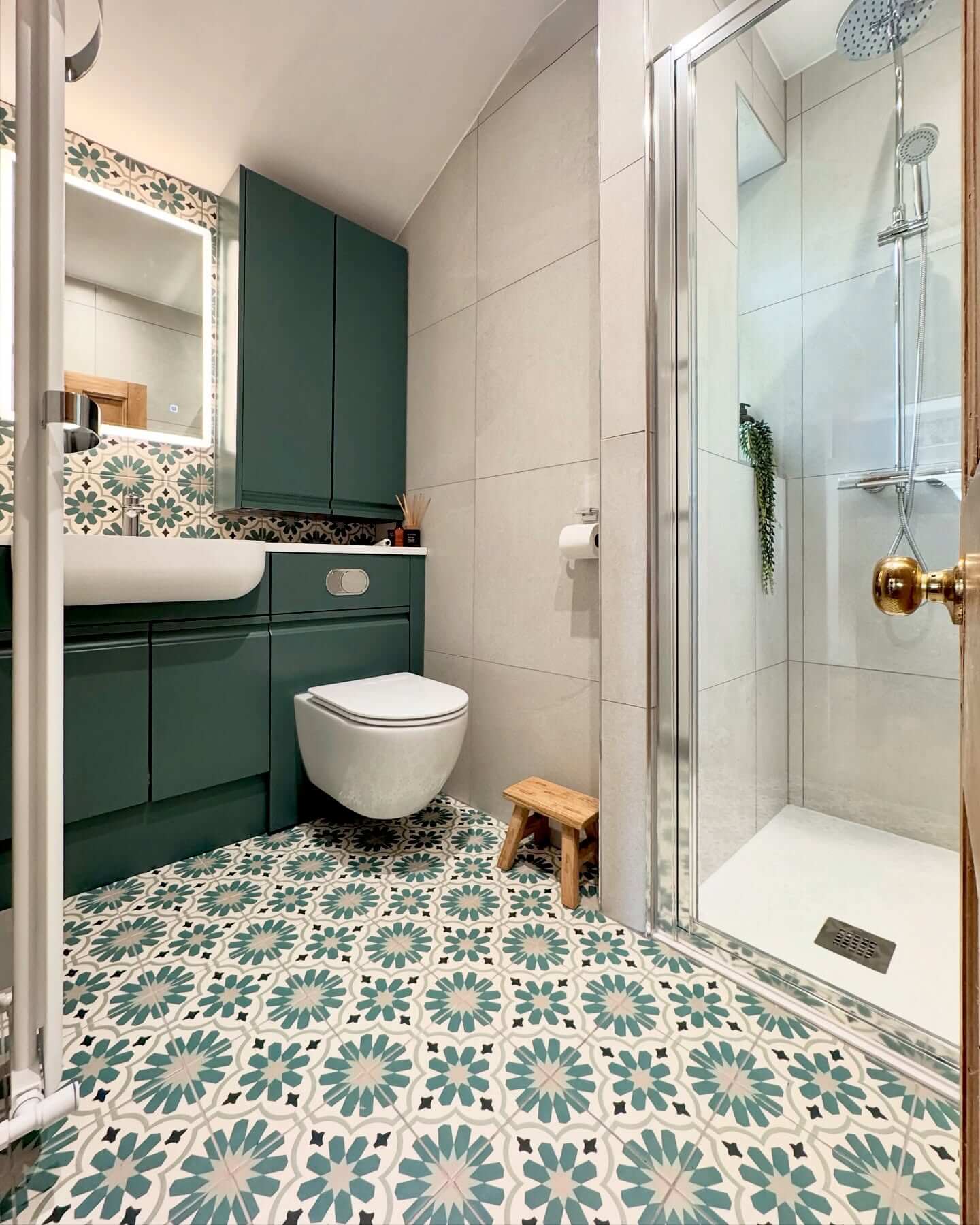 Bold Floor Tiles Visually Expand a Compact Bathroom