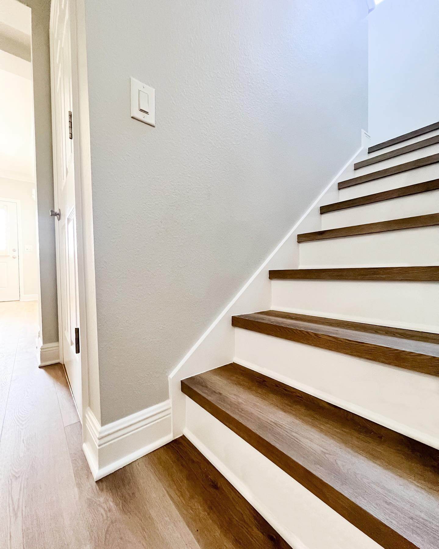 Crisp White Risers Frame Warm Wood Stair Treads