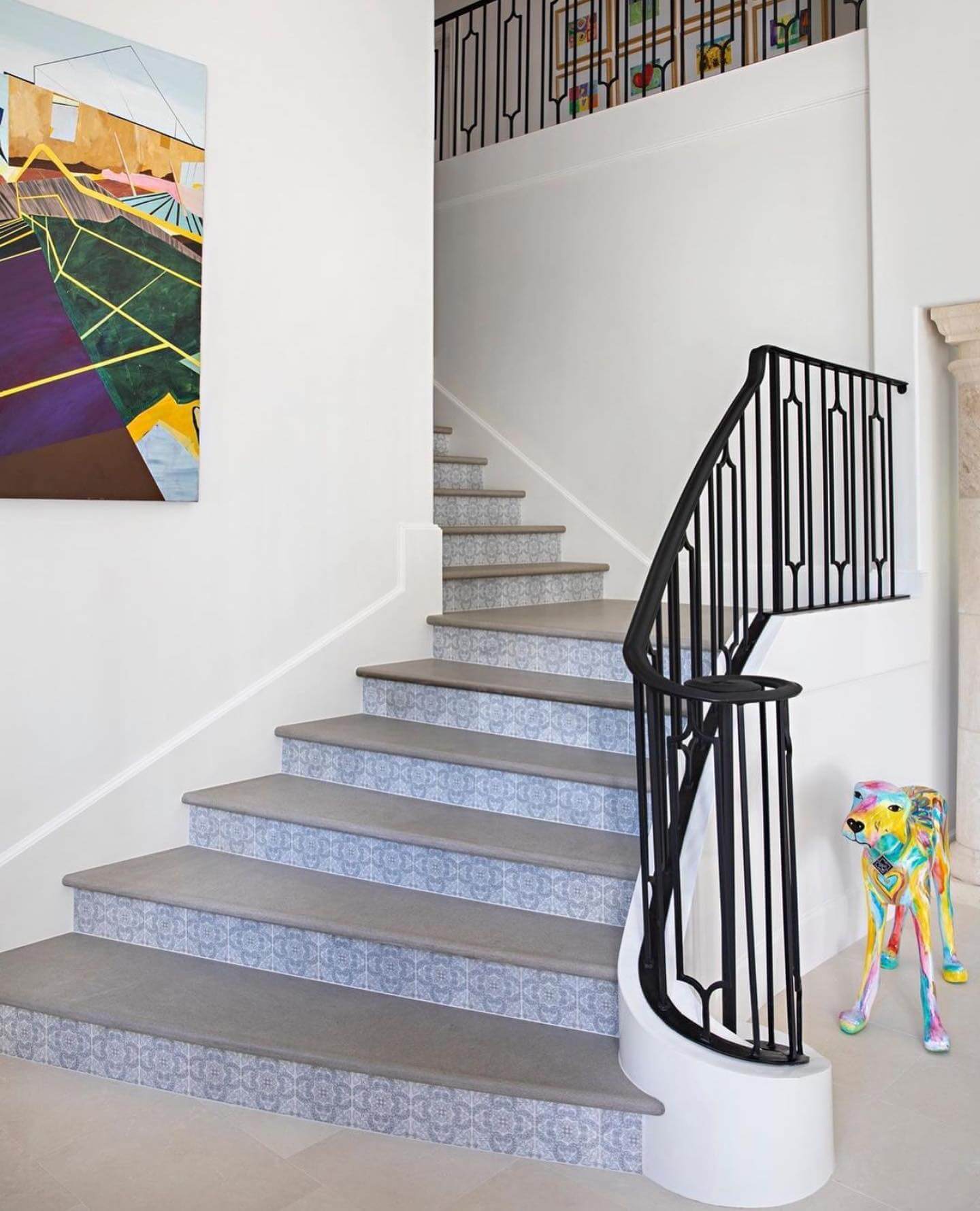 Subtle Blue Patterned Tiles Add Delicate Detail to Stair Risers