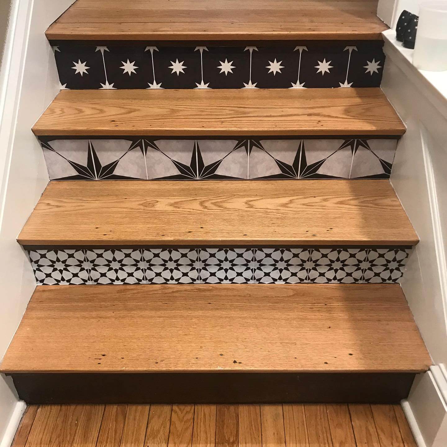 Alternating Geometric Tile Patterns Create Stair Riser Interest