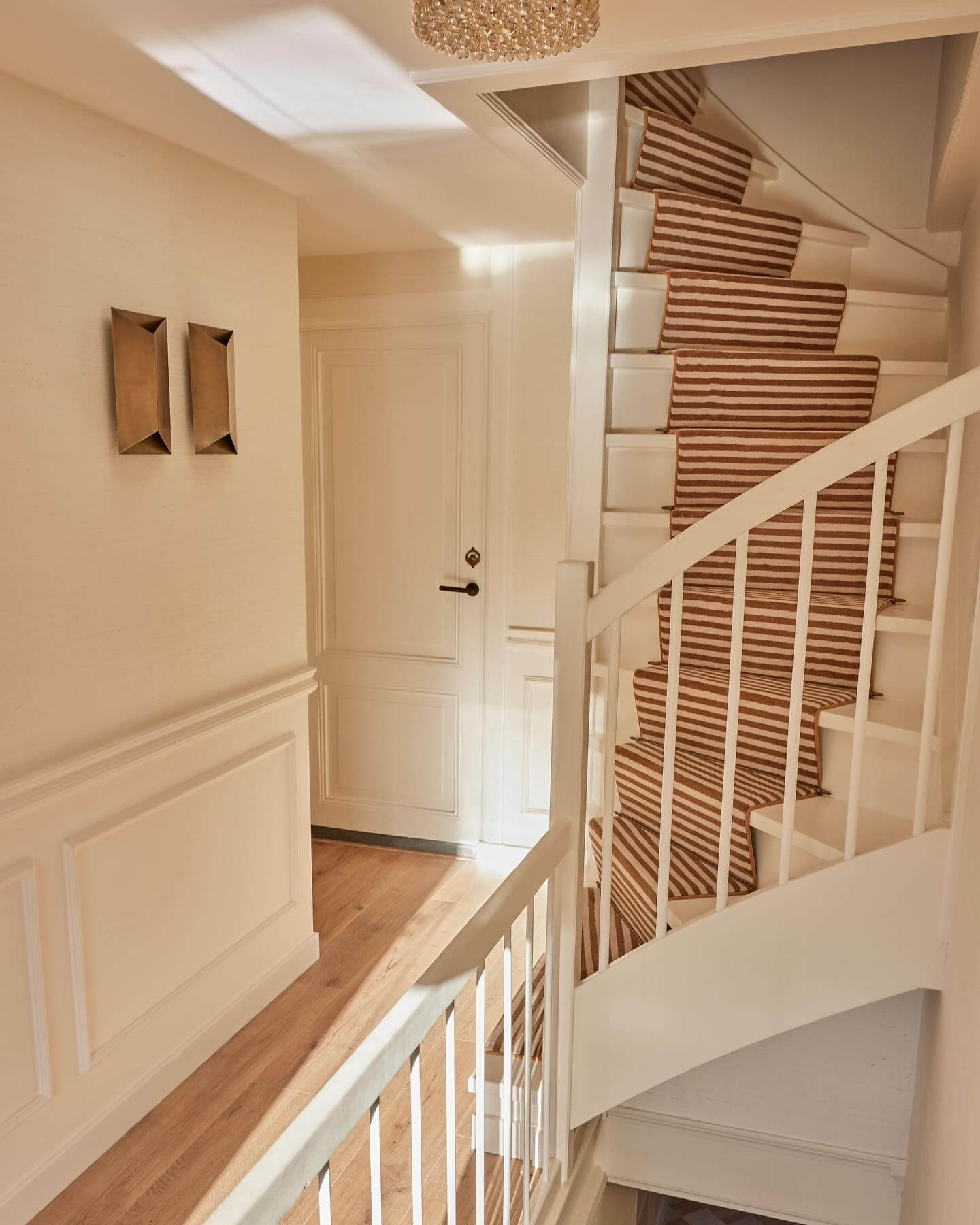 Brown and White Stripe Runner Adds Warmth to Stairs