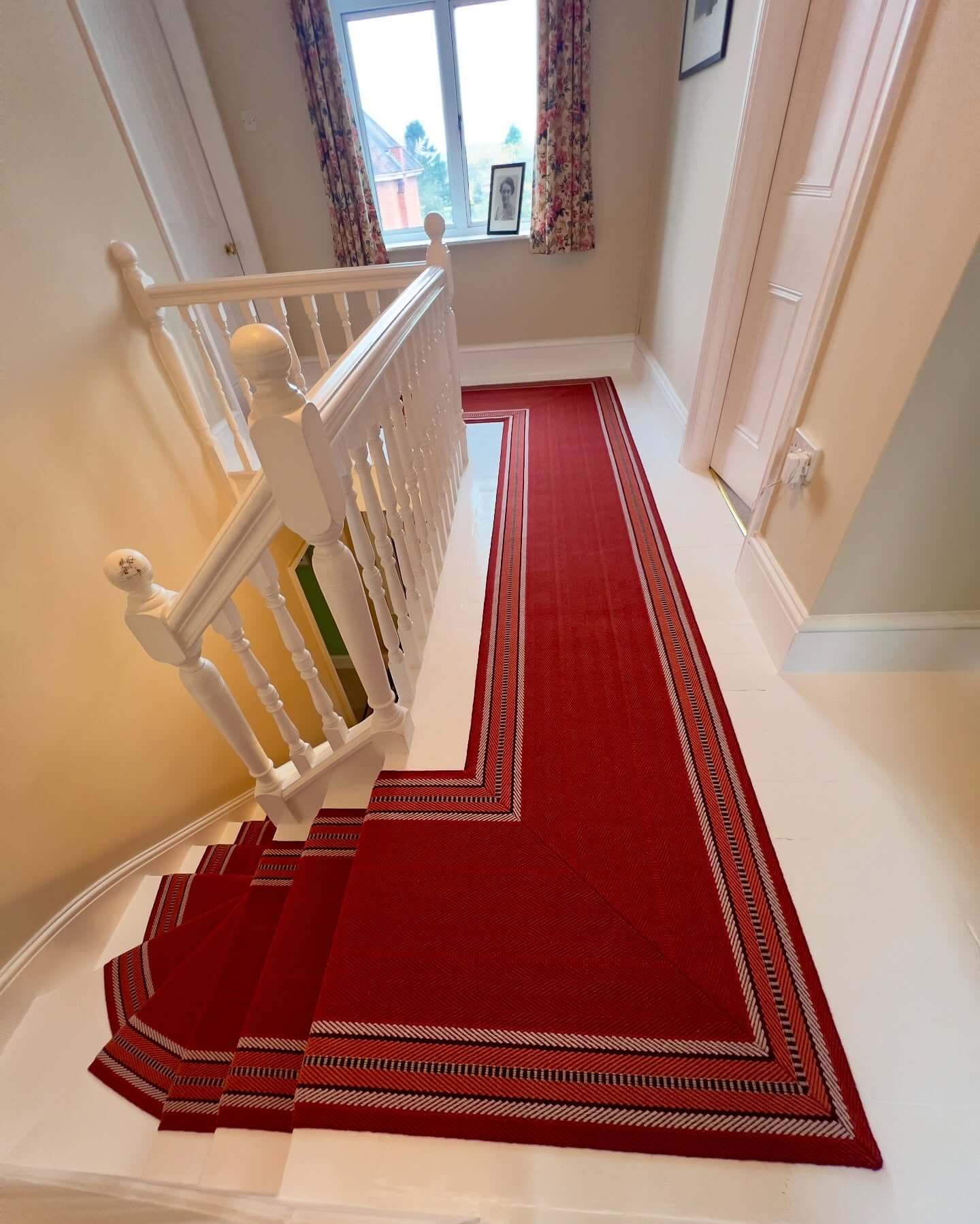 Layered Red Stair Runner With Geometric Border Detail