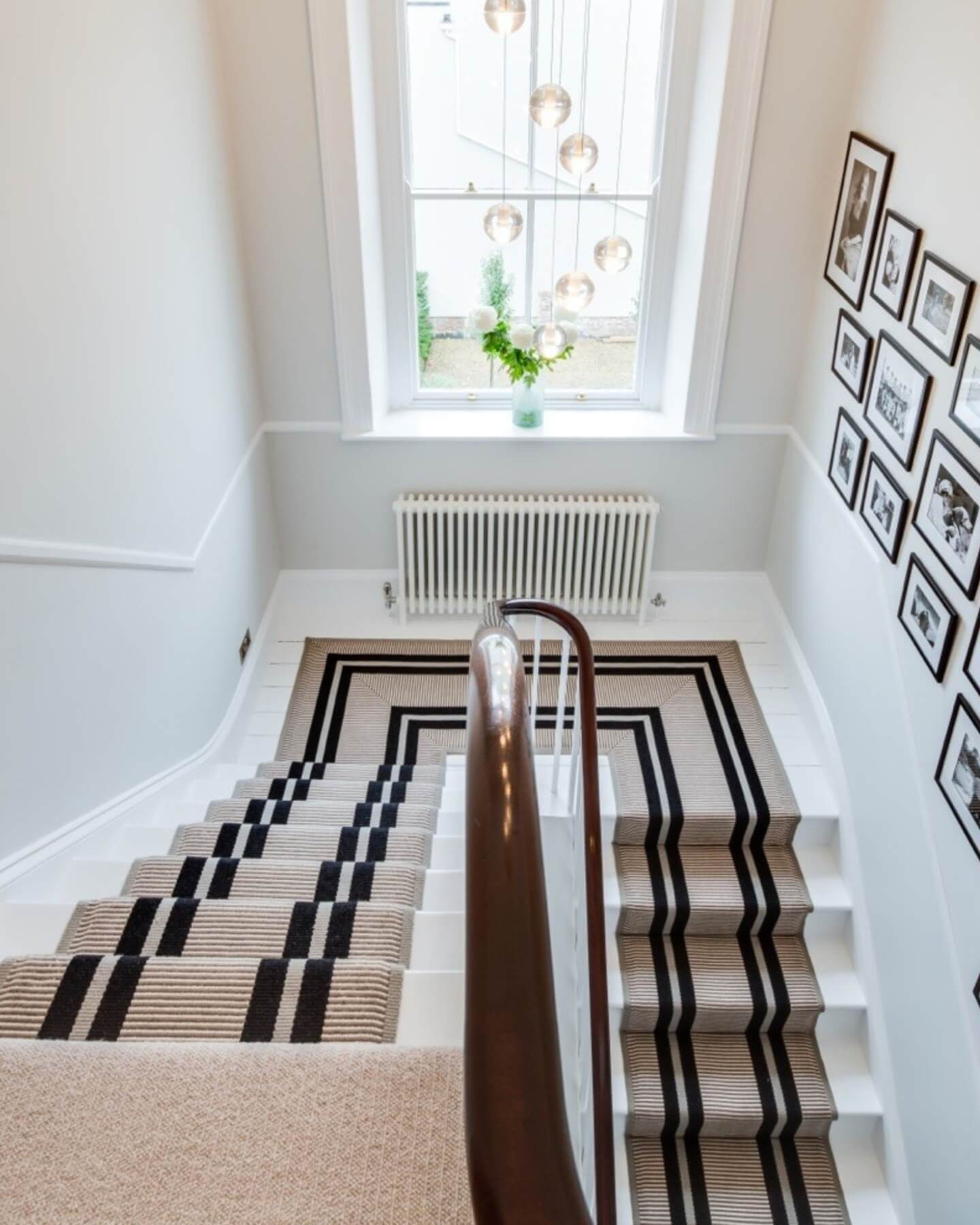 Geometric Black and Beige Runner Creates a Bold Stairway Accent