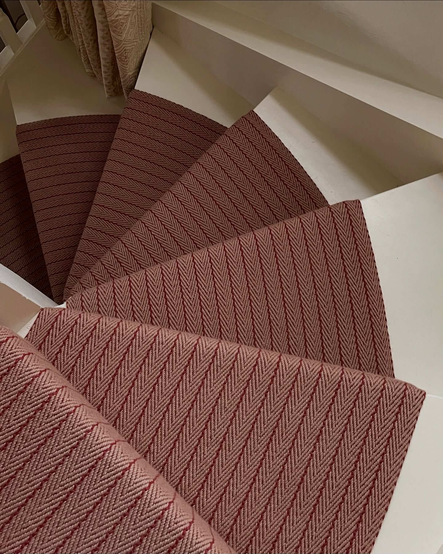 Dual-Tone Herringbone Runners Add Warmth to White Stairs