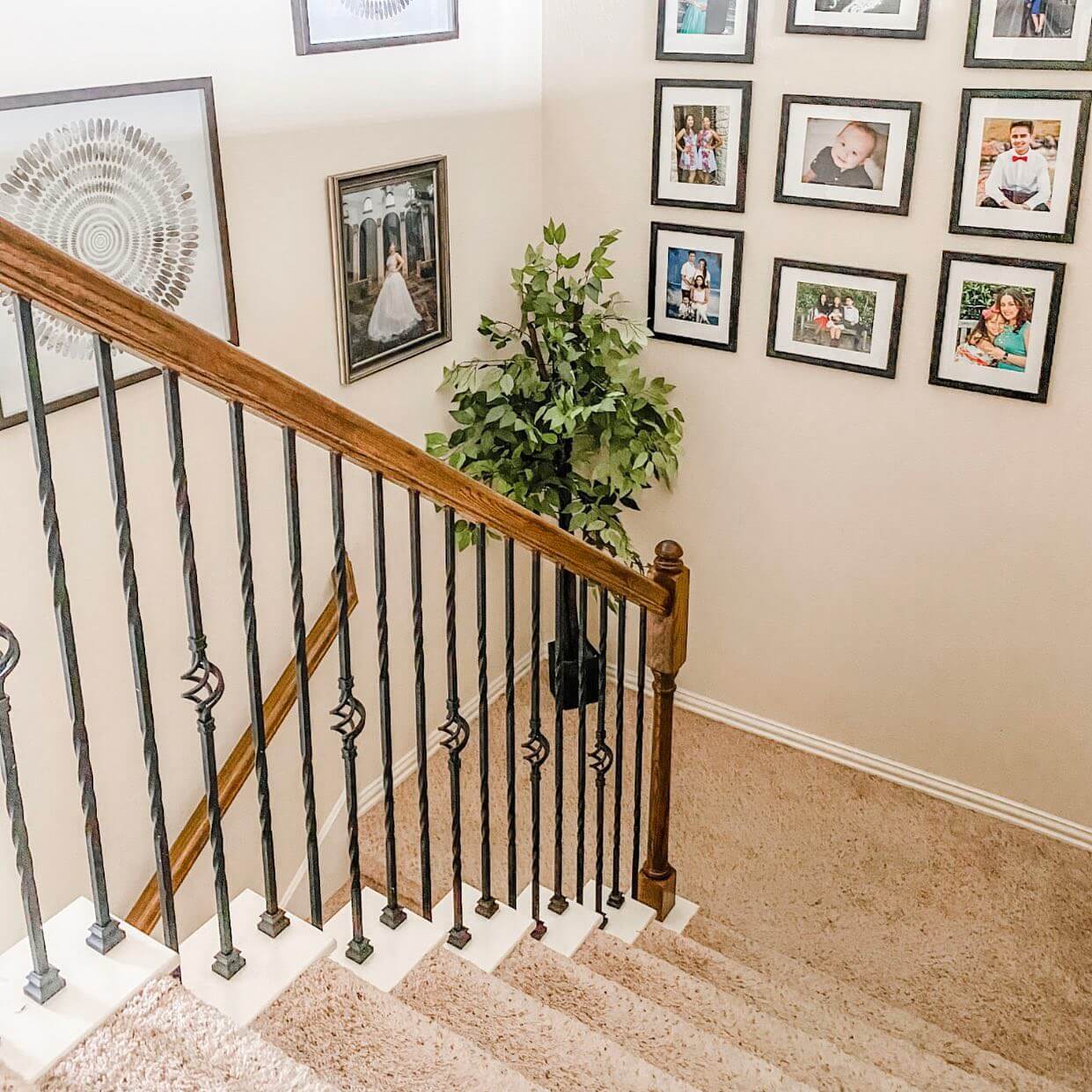 Grouped Family Photos Create a Stairwell Gallery Wall