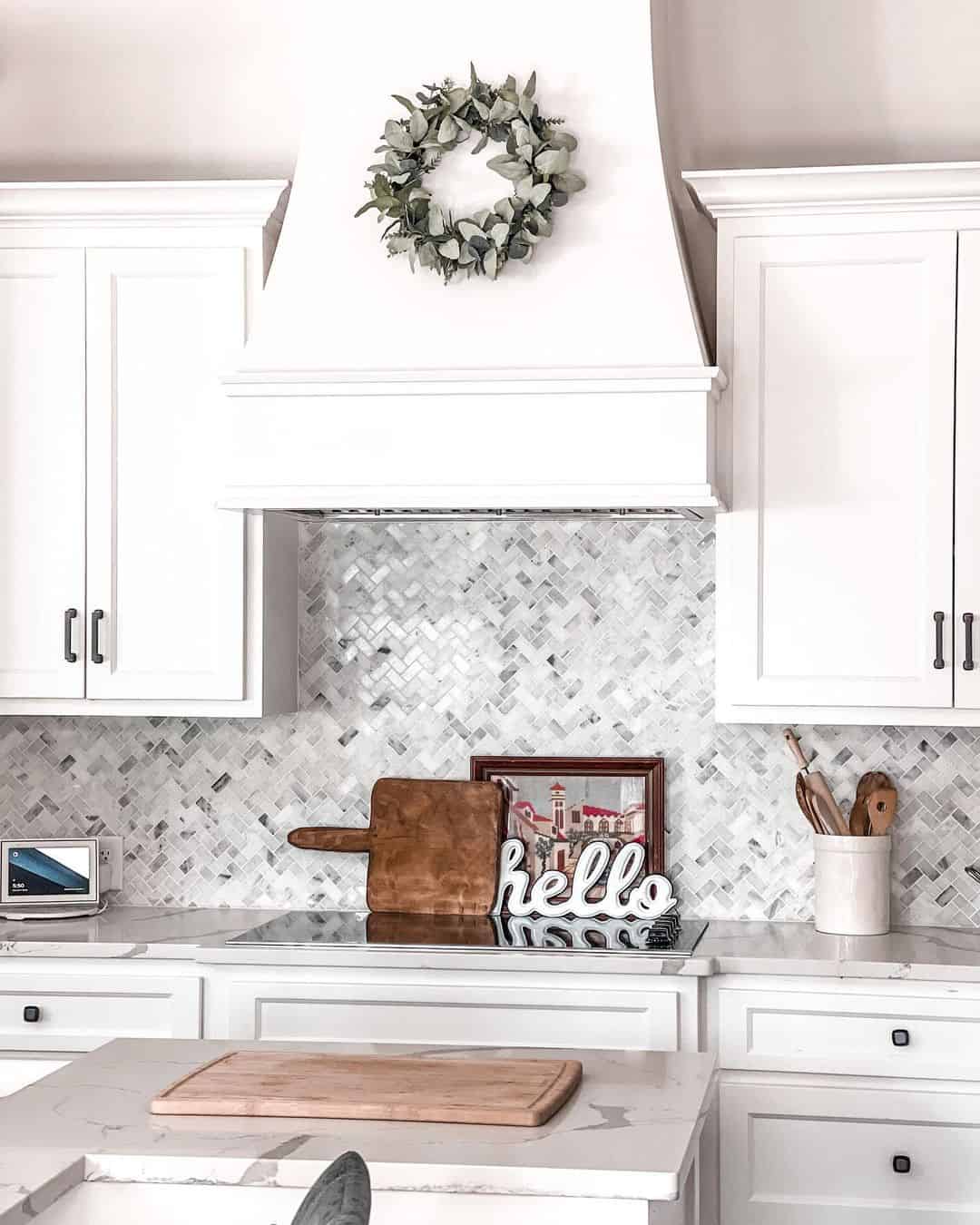 Marble Herringbone Backsplash Adds Subtle Dimension