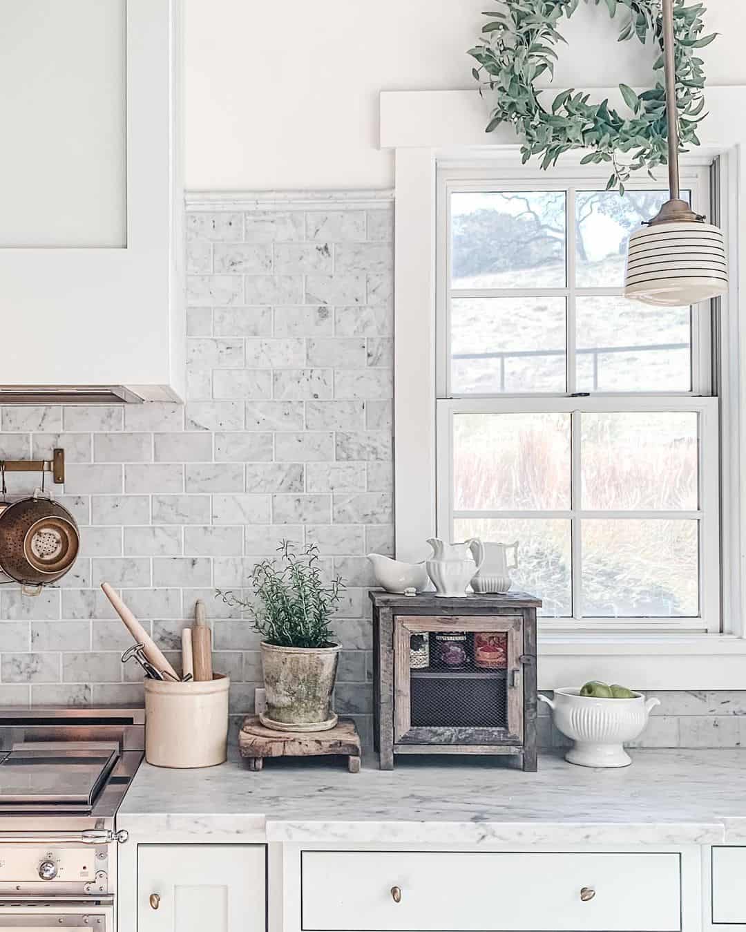 Marble Subway Tile Backsplash With a Rustic Wooden Cabinet