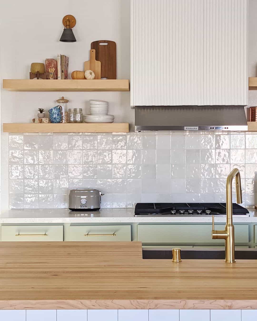 Textured White Square Tiles Add Subtle Shine Behind the Range