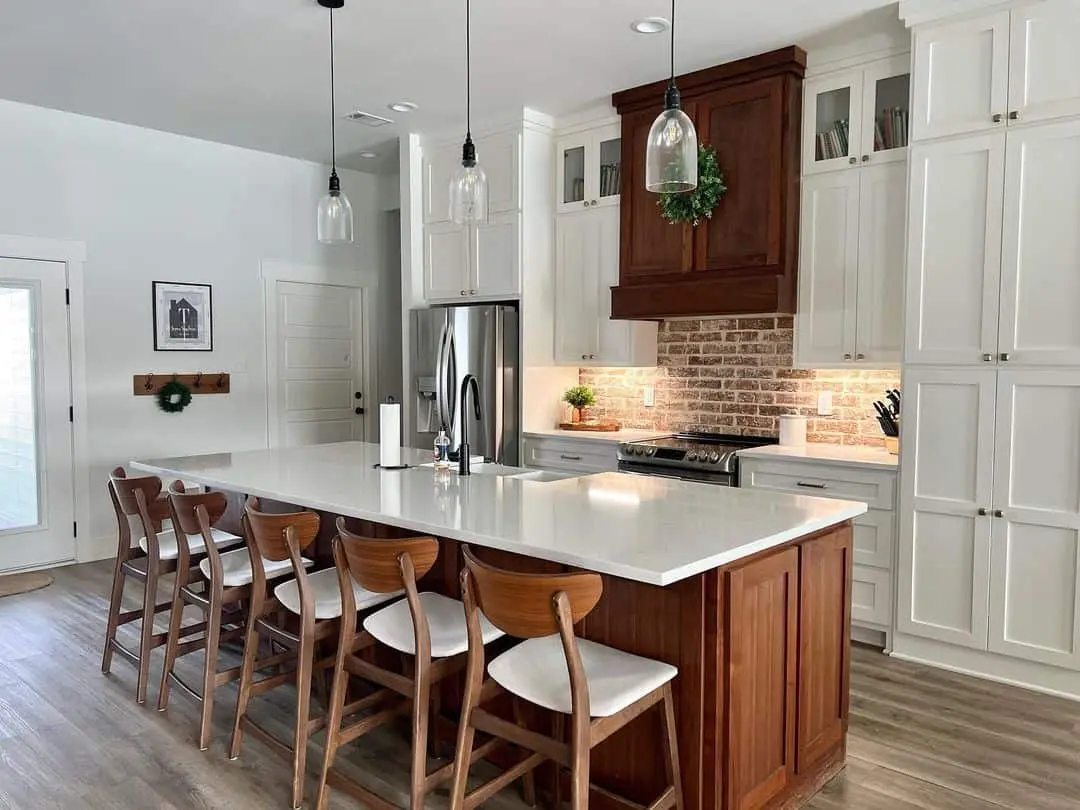 Rustic Brick Backsplash Adds Warmth To White Cabinets