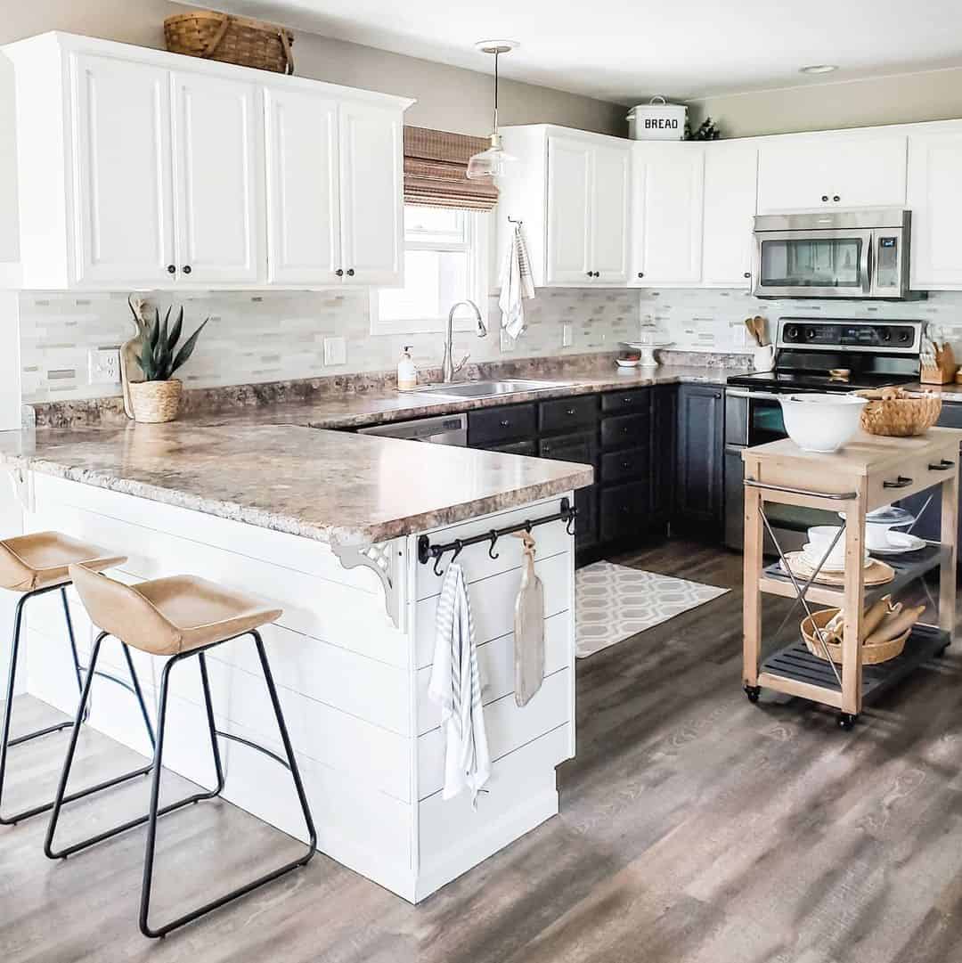 Subtle horizontal mosaic backsplash behind white cabinets