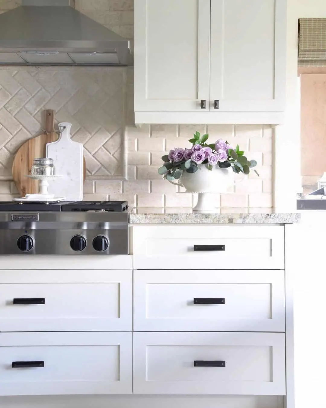 Subtle Herringbone Tile Backsplash Adds Soft Texture