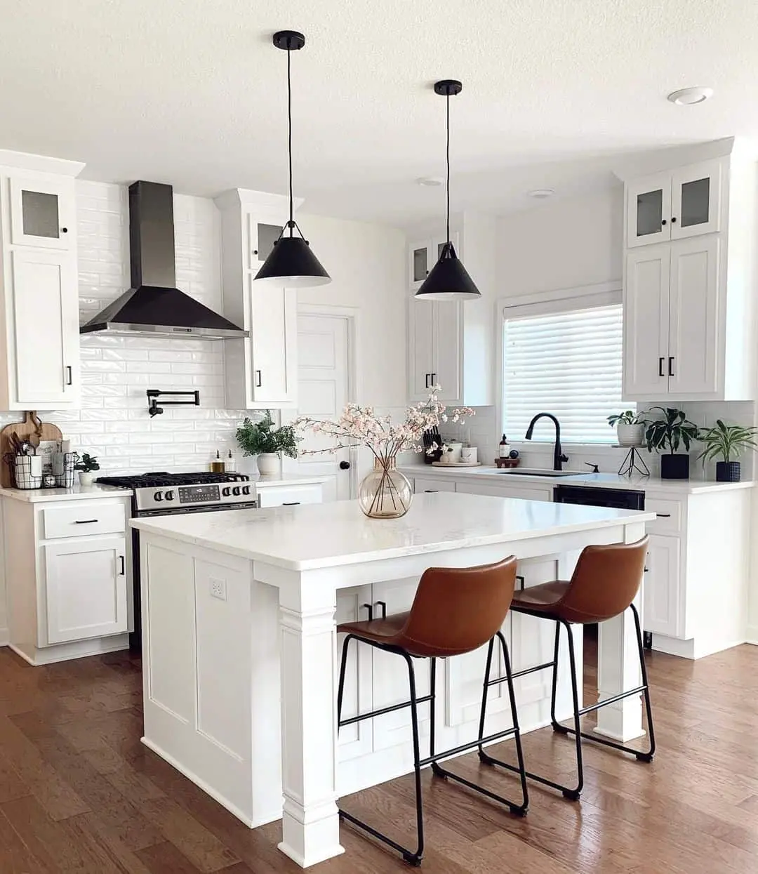 White Subway Tile Backsplash With Black Range Hood