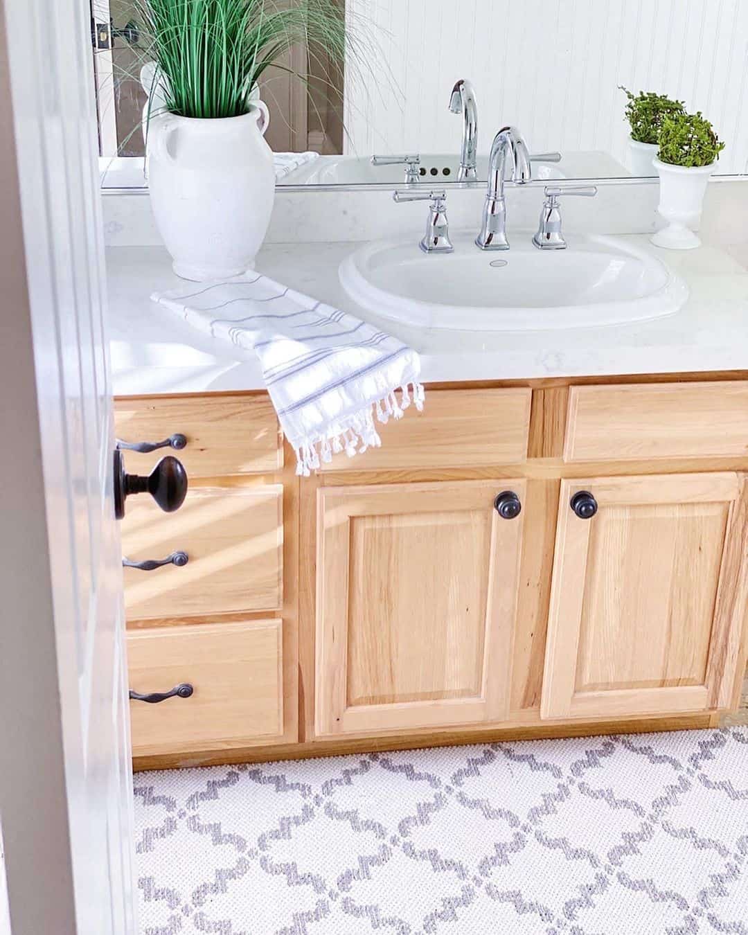 Light Wood Vanity with Dark, Rounded Bin Pulls
