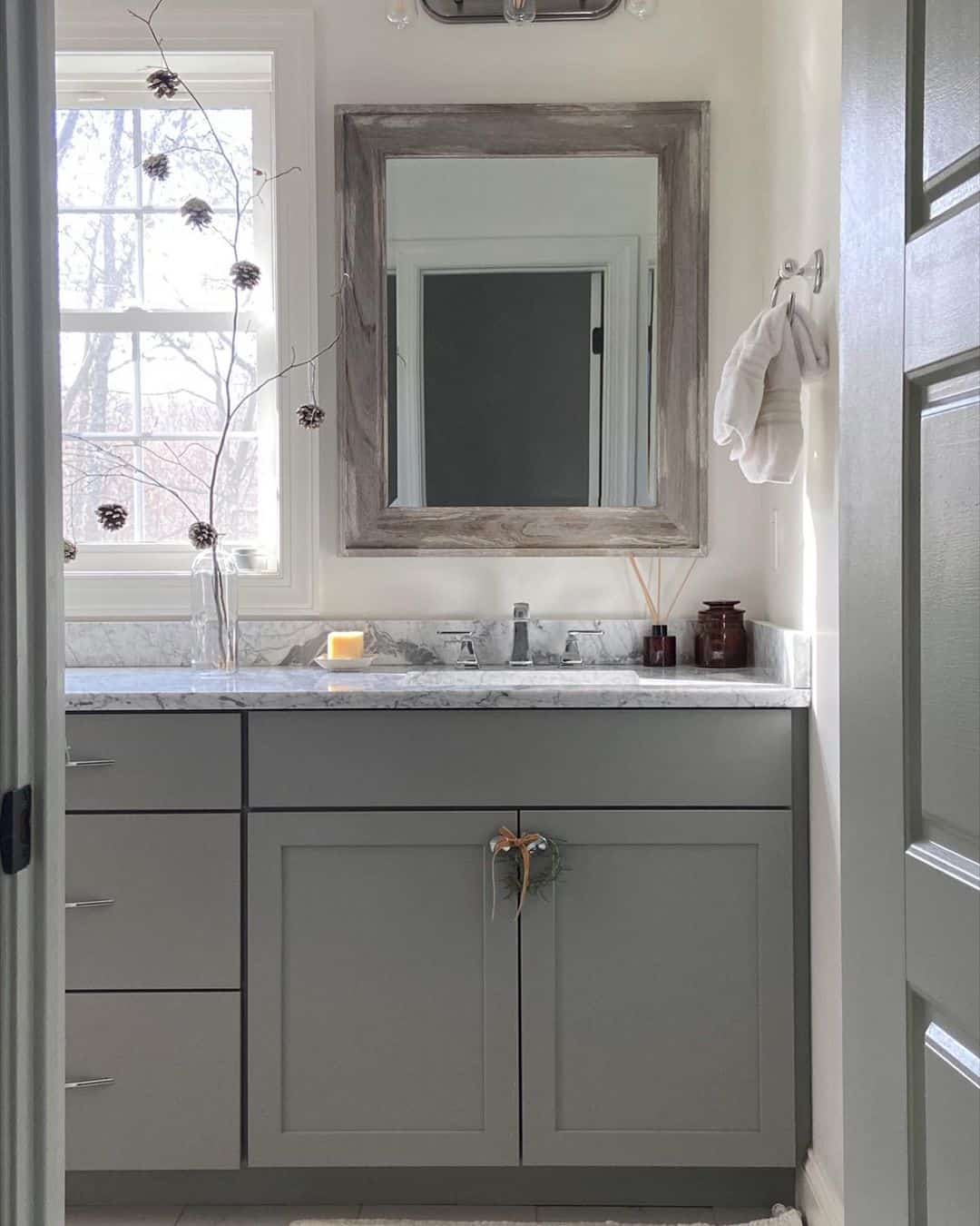 Gray Shaker Cabinets with a Subtle Heart-Shaped Wreath