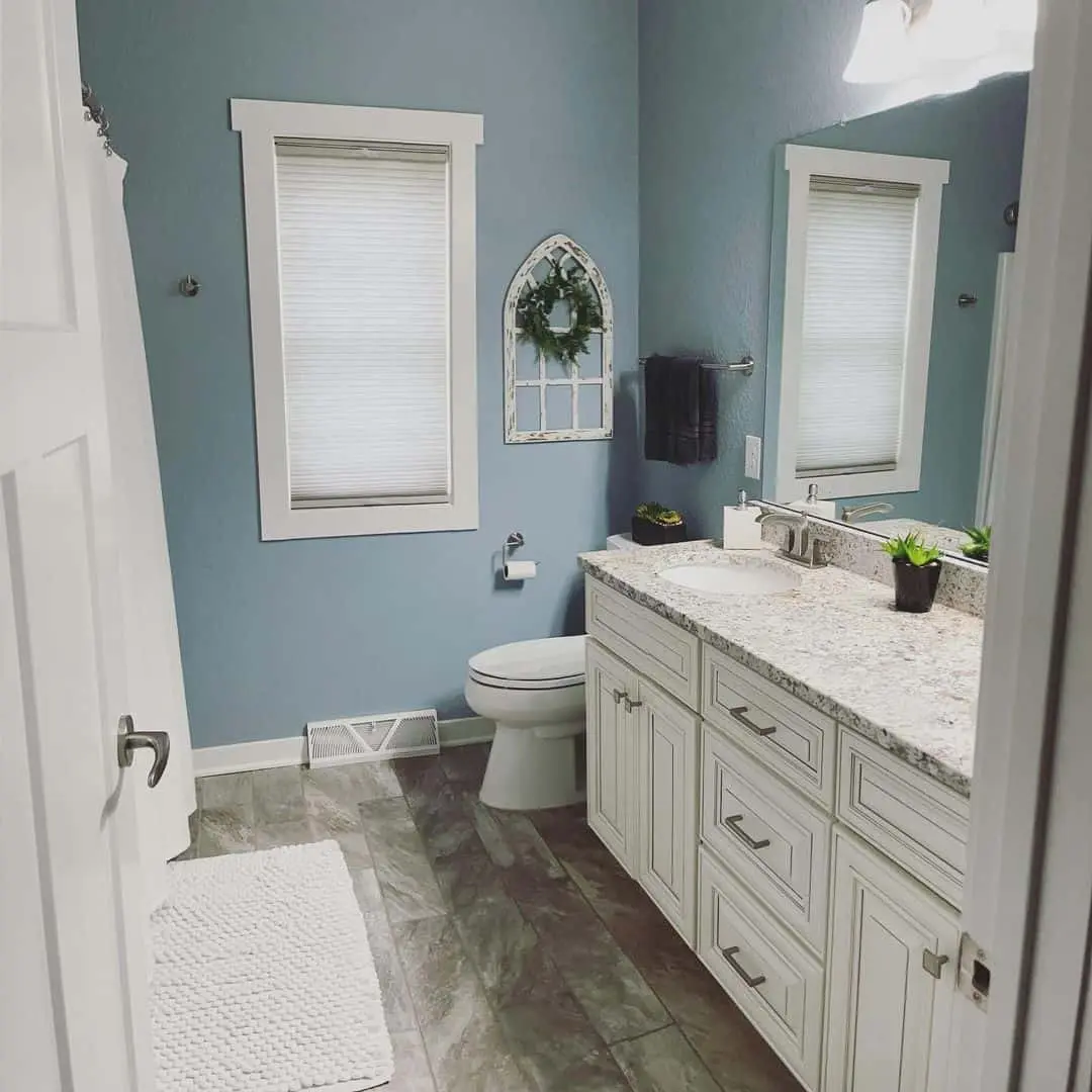 Arched Window Frame Adds Rustic Charm Above Toilet