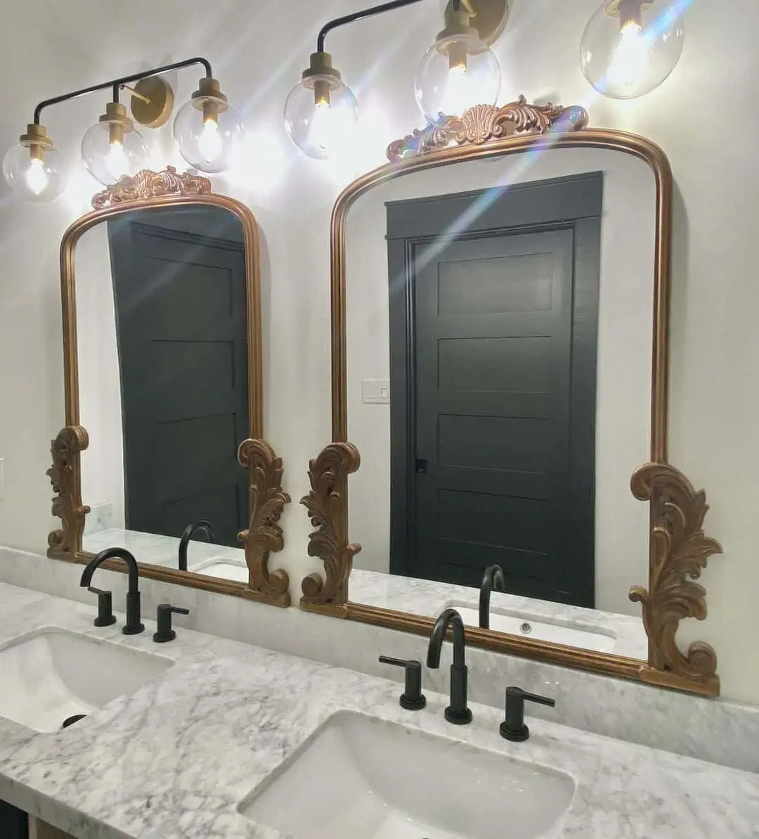 Ornate Mirror Frames Add Vintage Flair Above Dark Vanity