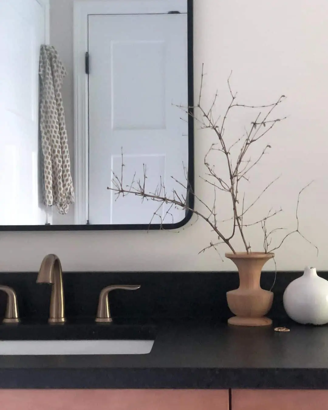 Wooden Vase Displays Delicate Branches on Dark Countertop