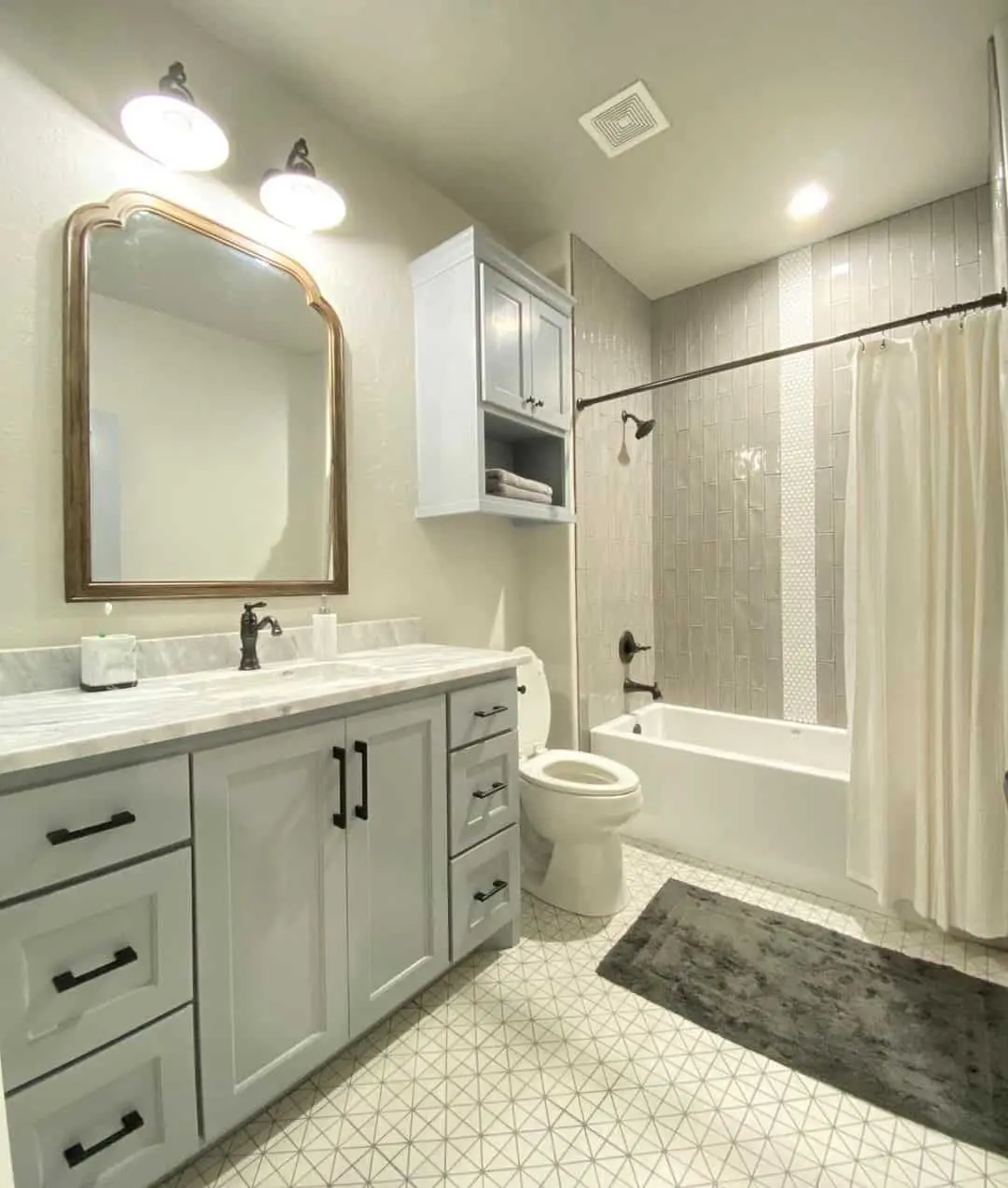 Geometric Floor Tile Grounds a Light Gray Vanity