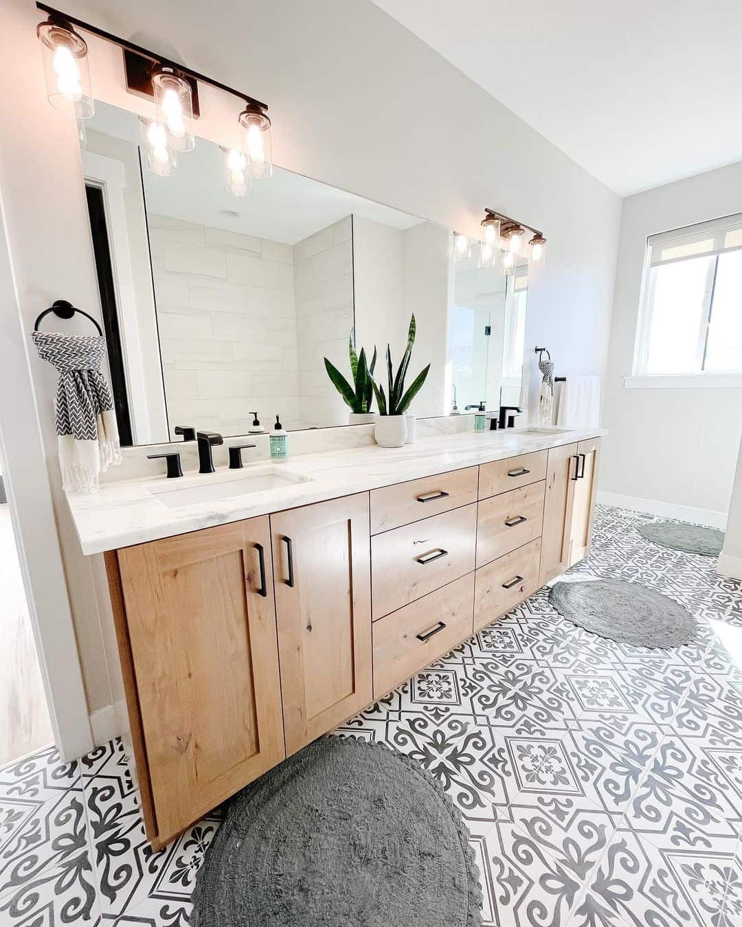 Tall Snake Plant Adds Architectural Greenery to Marble Vanity