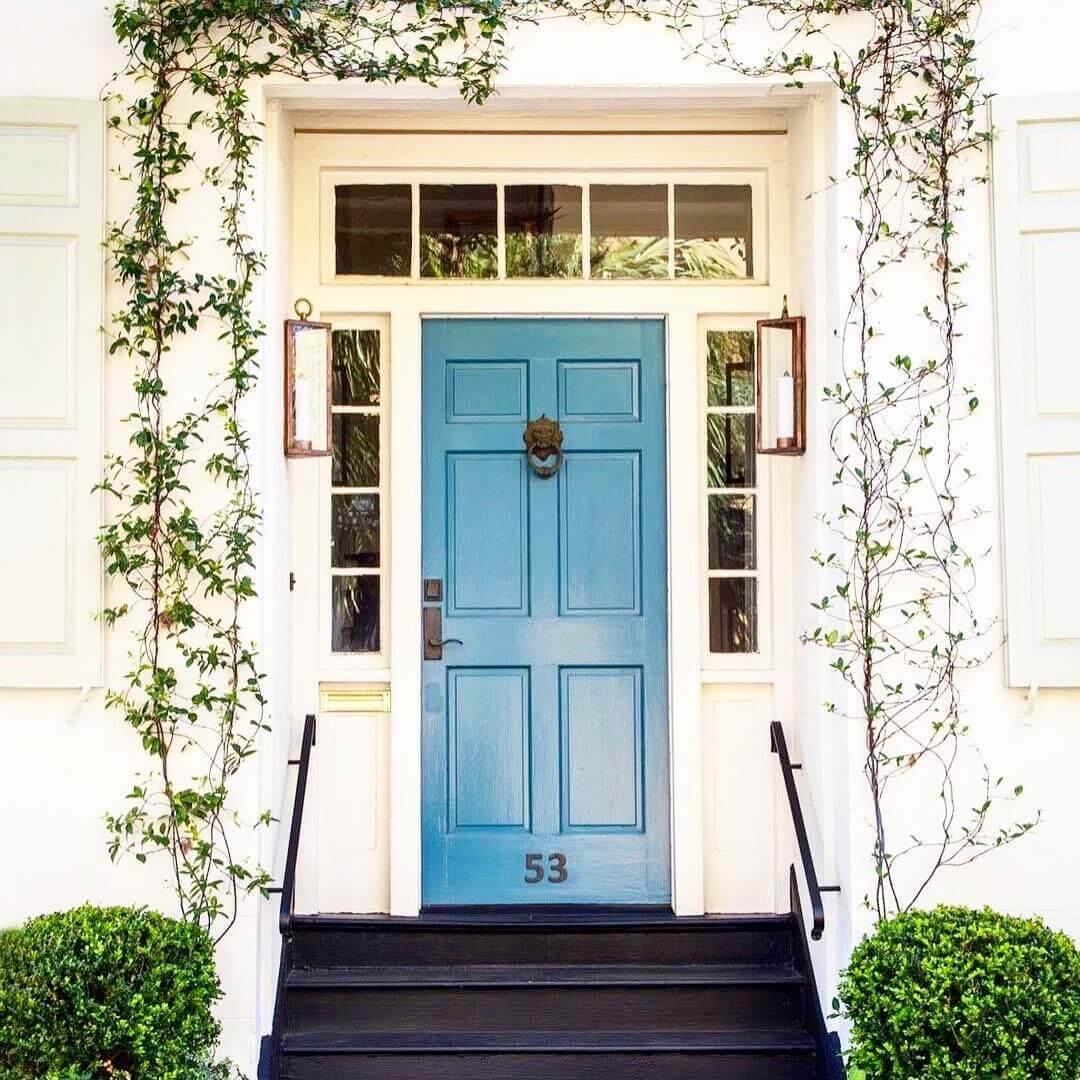 Blue Door With A Lion Head Knocker and House Number