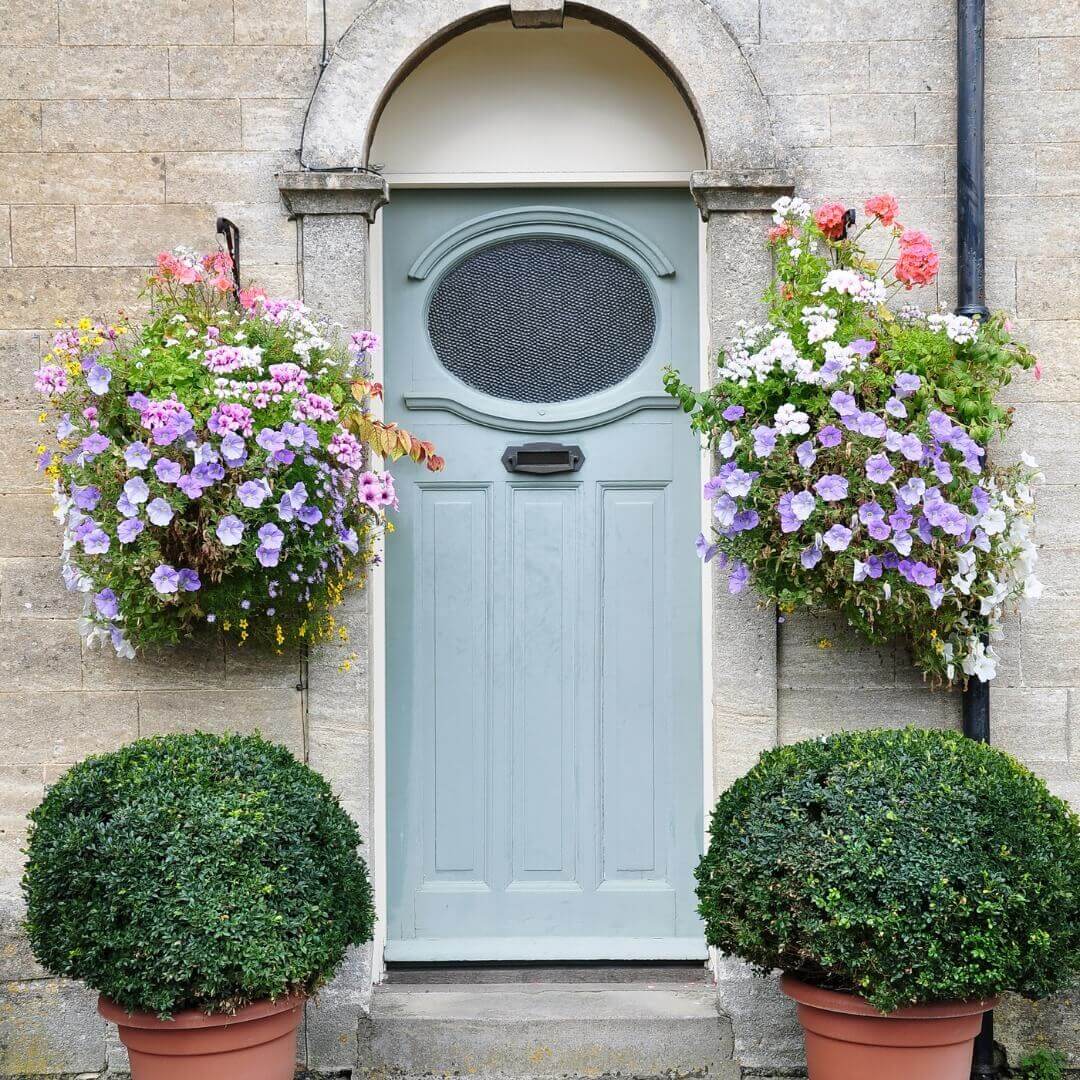 Soften Your Entry with Cascading Flower Baskets