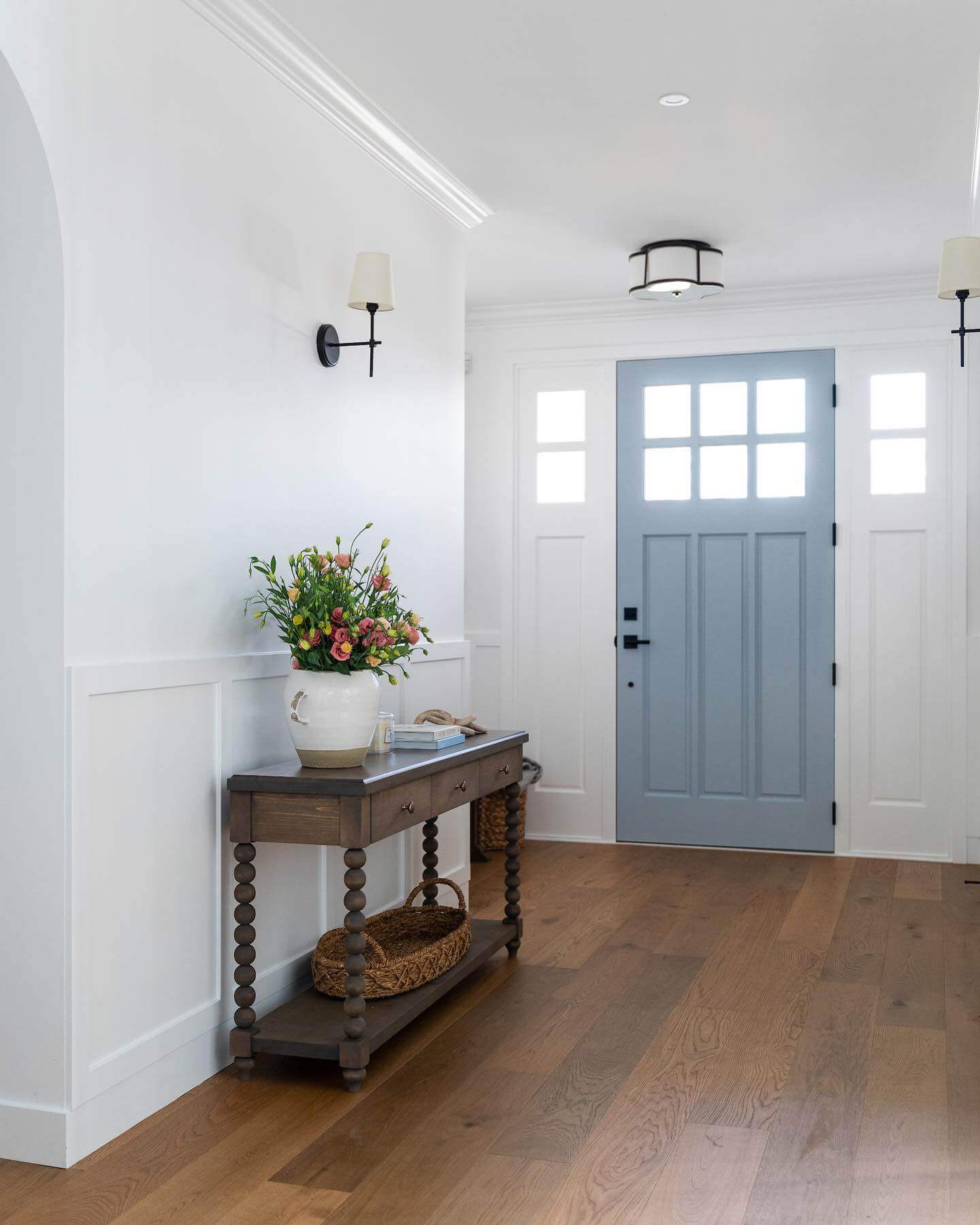 Contrast a Muted Blue Door with Black Hardware