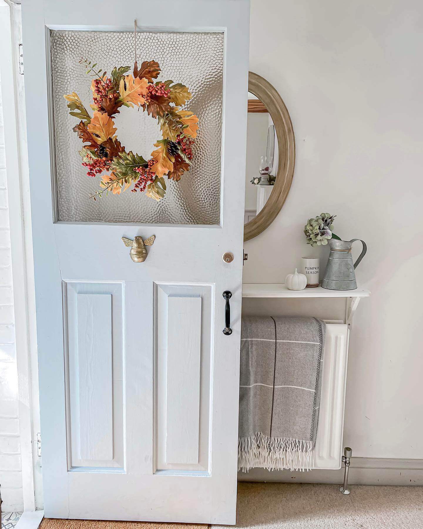 Bee-Shaped Door Knocker Adds Whimsical Charm to a Blue Door