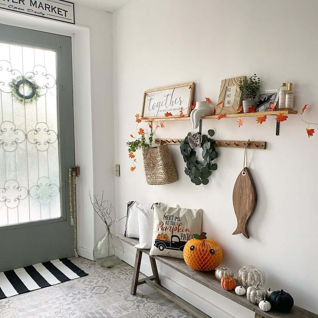 Entryway Bench Displays a Collection of Textured Pumpkins