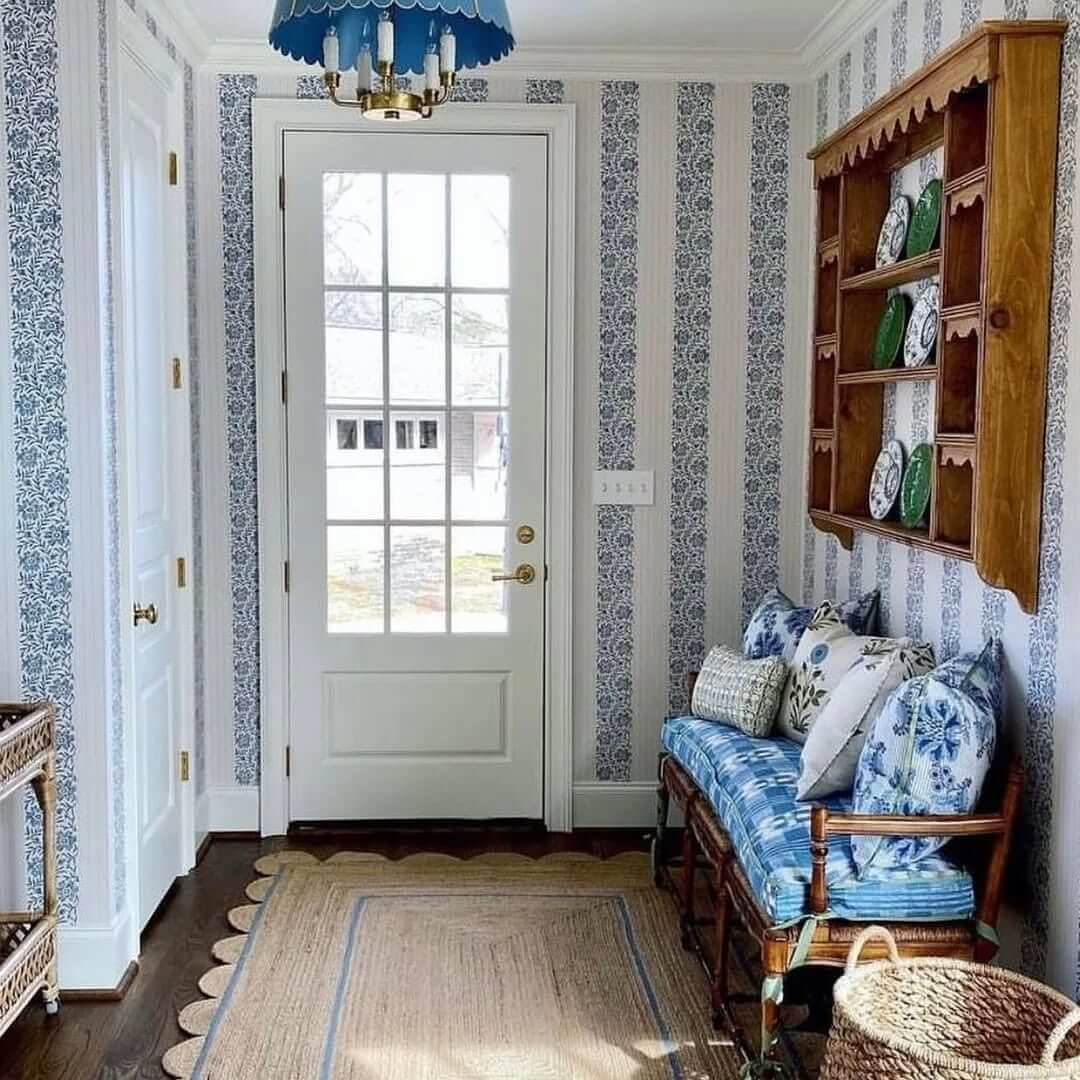 Wooden Wall Shelf Displays Plates Above Entryway Bench