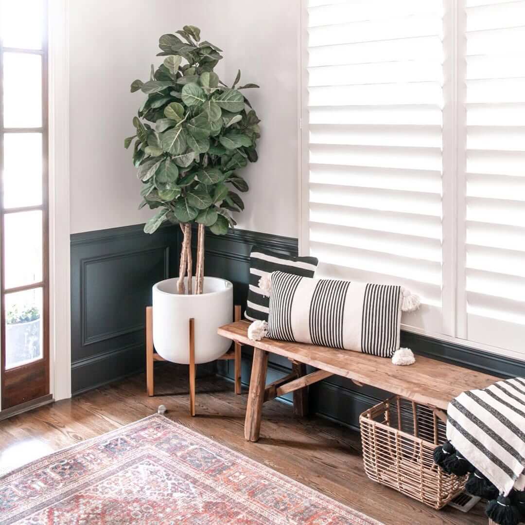 Rustic Wooden Bench With Striped Pillows and Basket