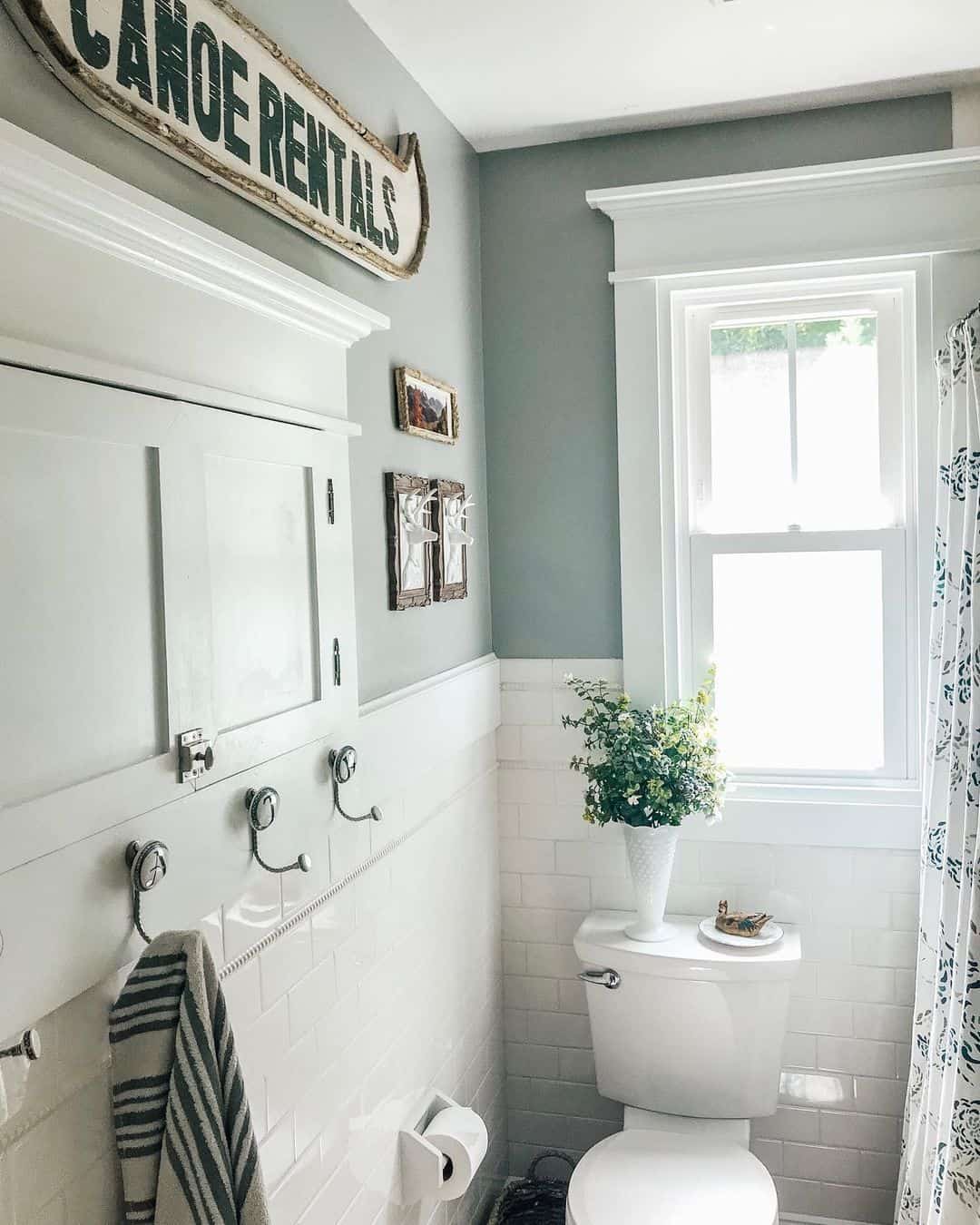Rustic Signage Adds Vintage Charm Above the Medicine Cabinet